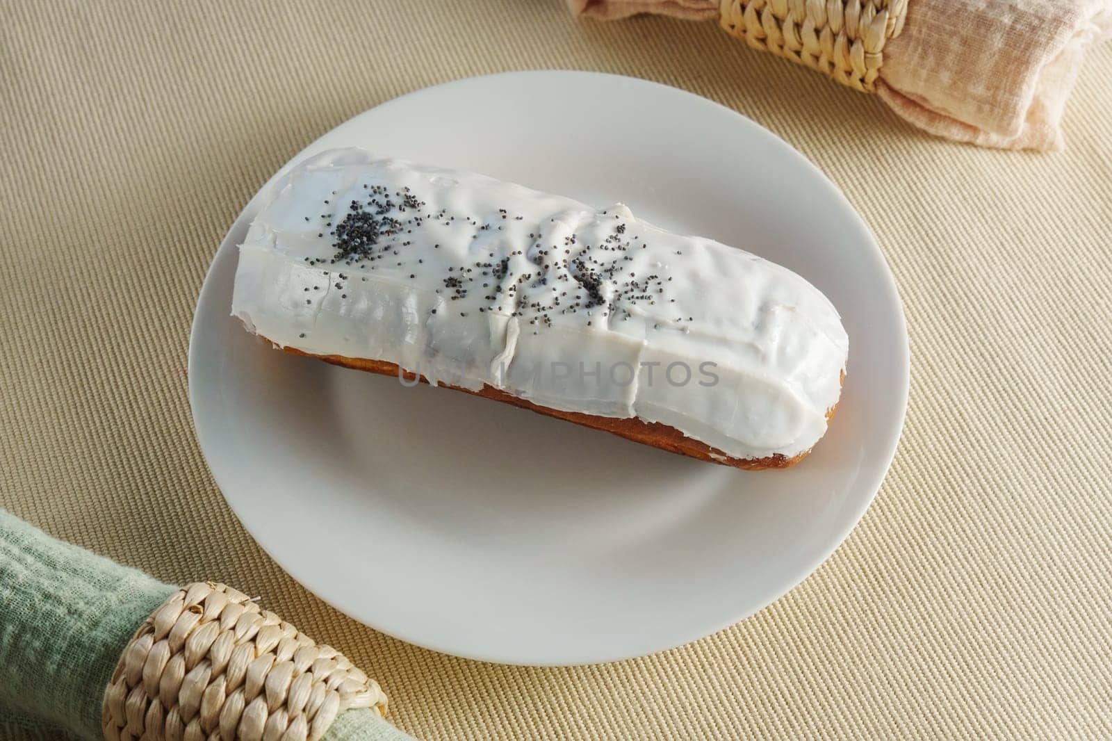 Donut with luscious frosting sits atop a pristine white plate, showcasing the perfect balance of flavors. by darksoul72