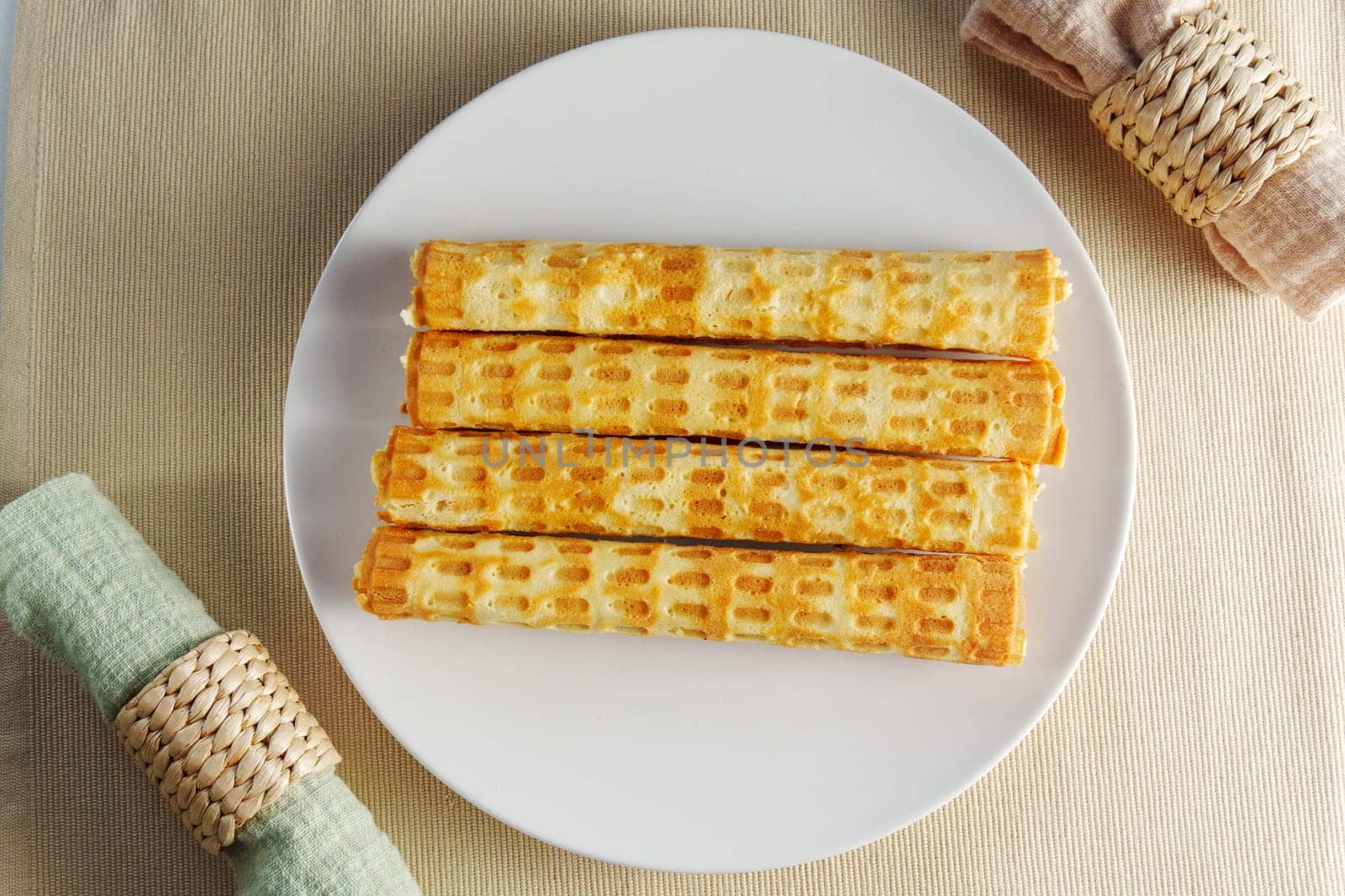 Ethereal Morning Delight: A Gourmet Stack of Golden Waffles on a Crisp White Plate