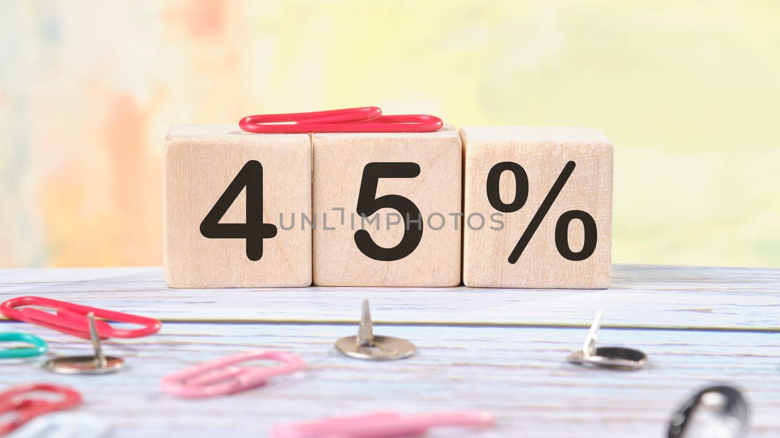 45 Percent text written on wooden cubes on a light colored background.