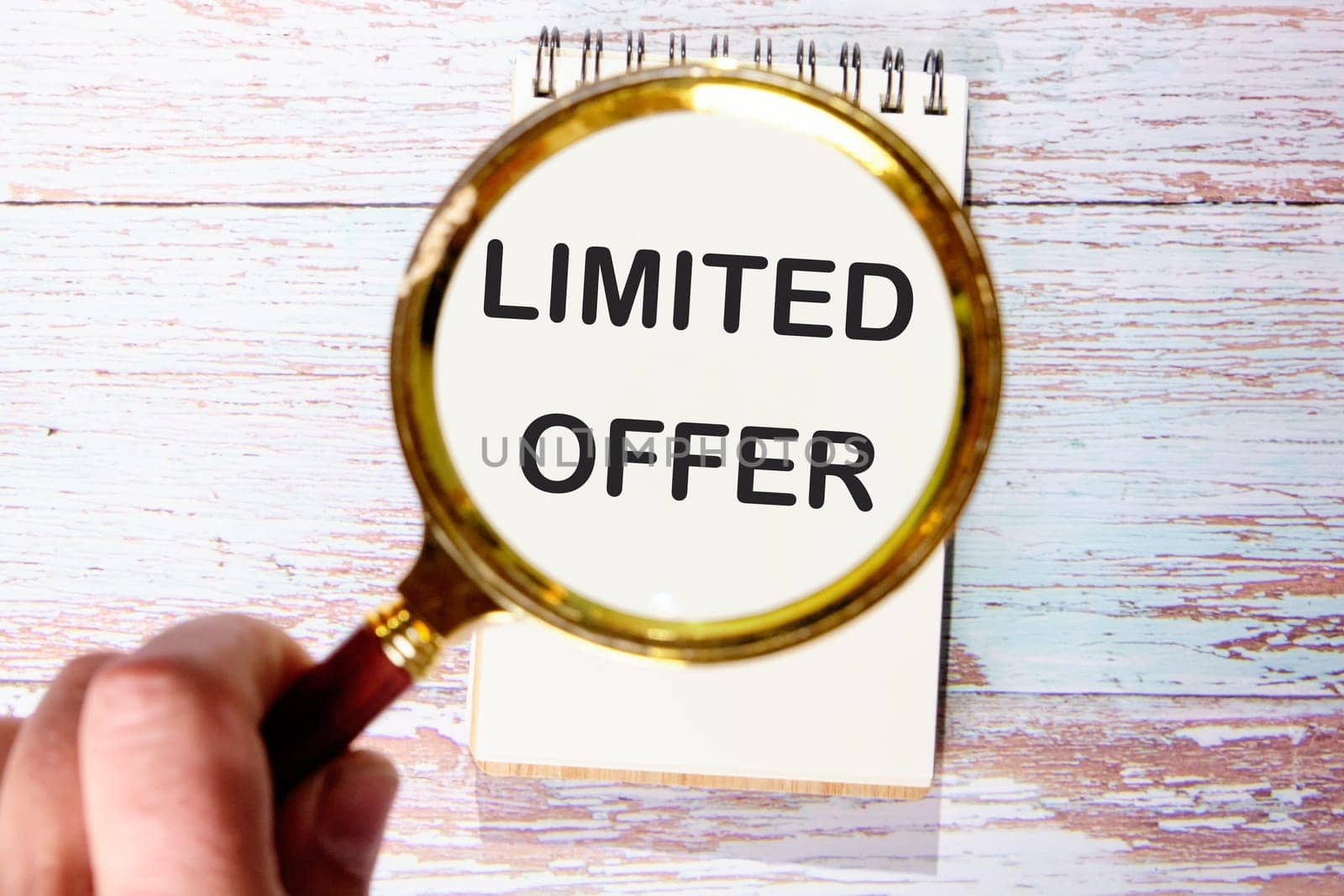 Limited offer text through a magnifying glass