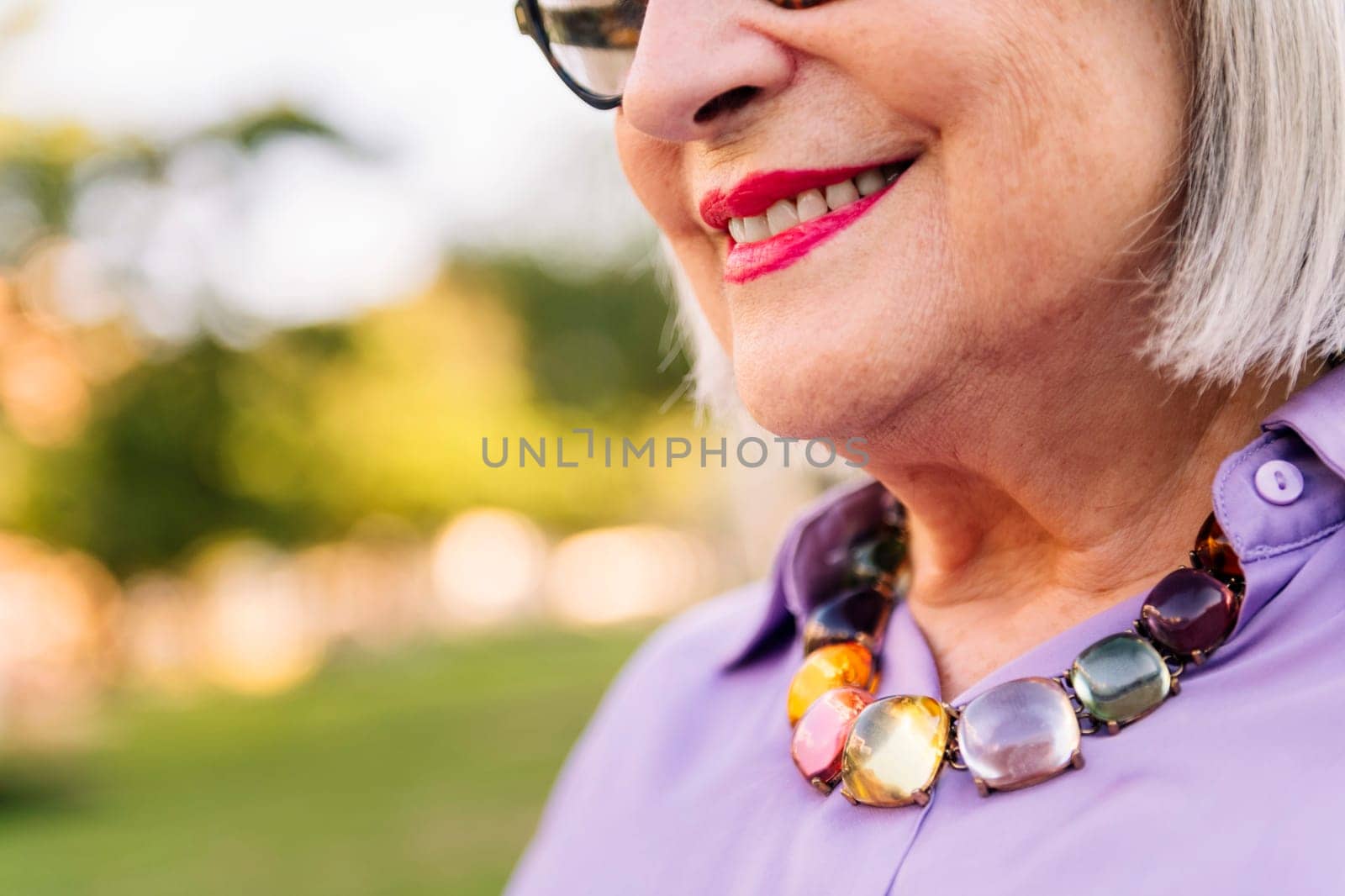 close-up of the smile of a senior woman by raulmelldo