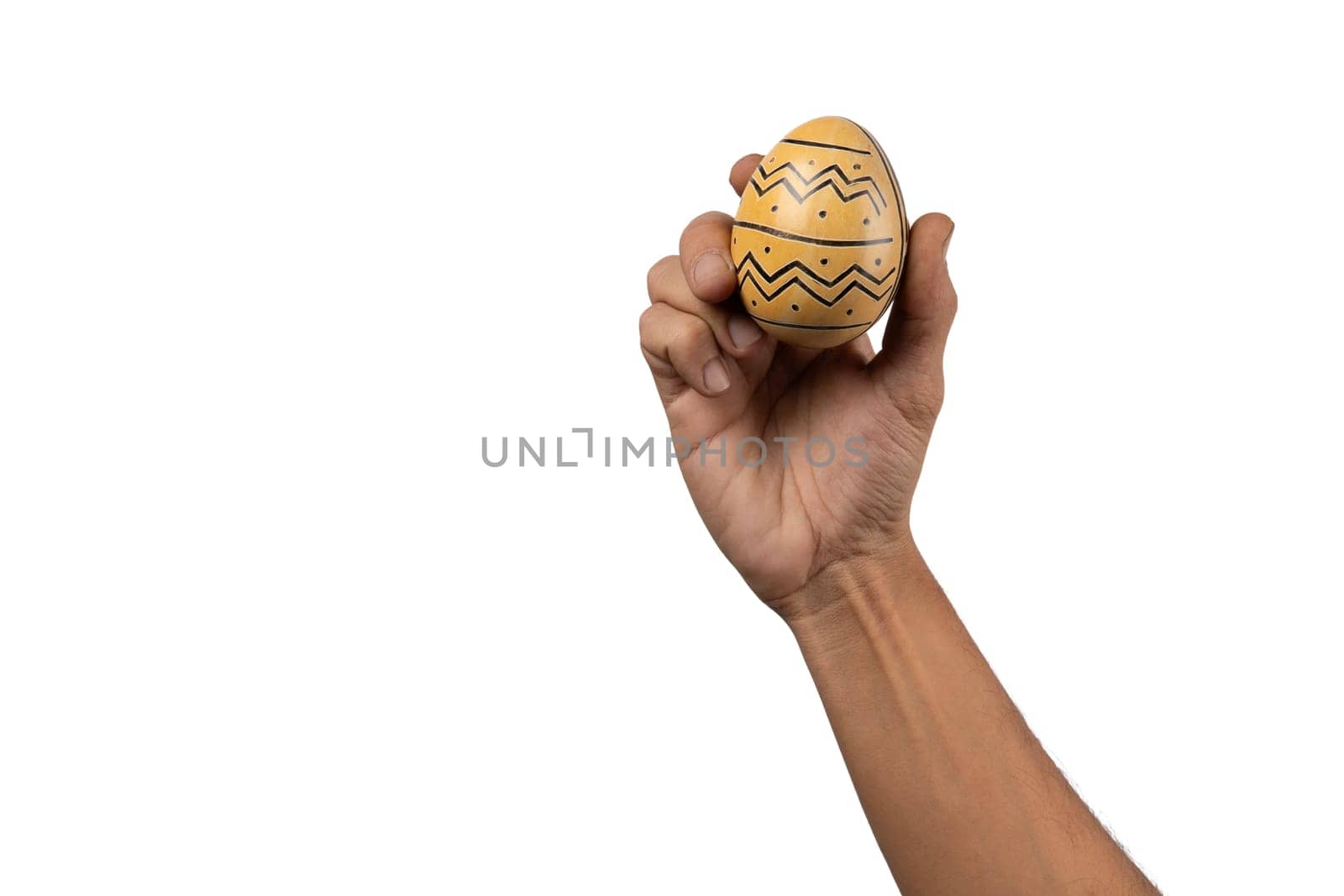 Black male hand holding easter egg with modern painting design isolated. by TropicalNinjaStudio