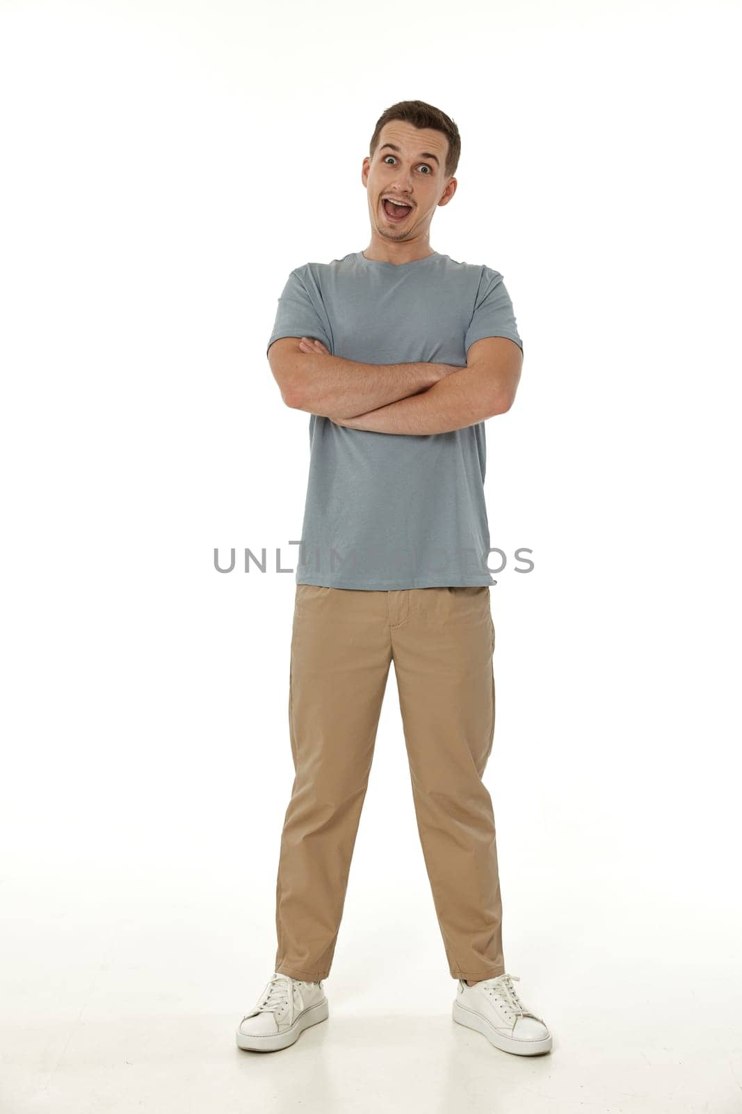 surprised guy looking at camera on white studio background