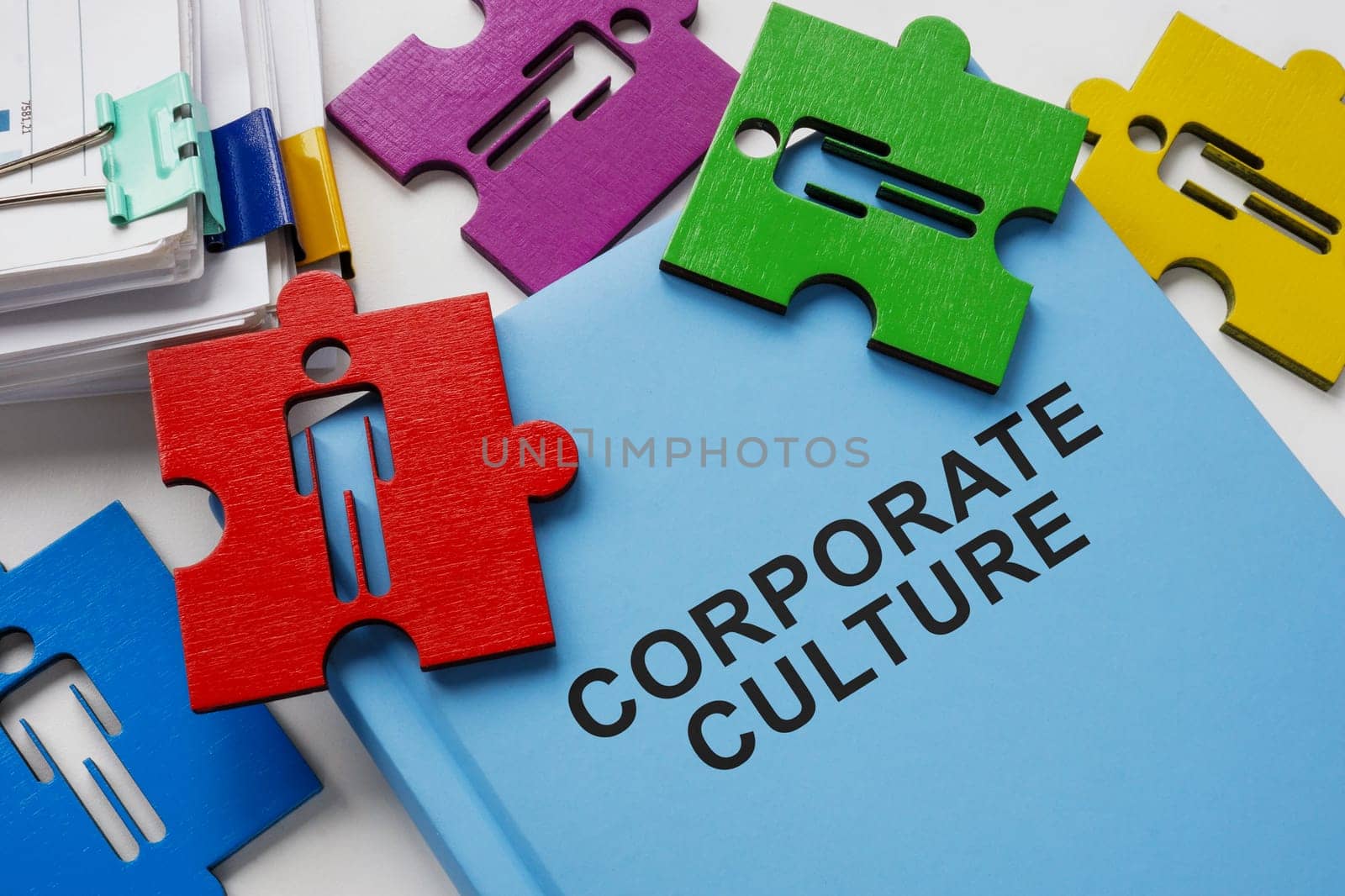 Book about corporate culture and puzzle pieces.