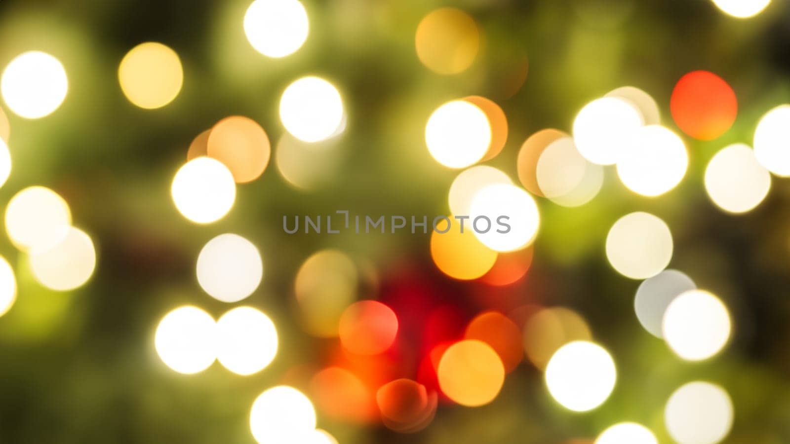 Abstract bokeh background, defocused christmas lights in christmas tree in red and gold.