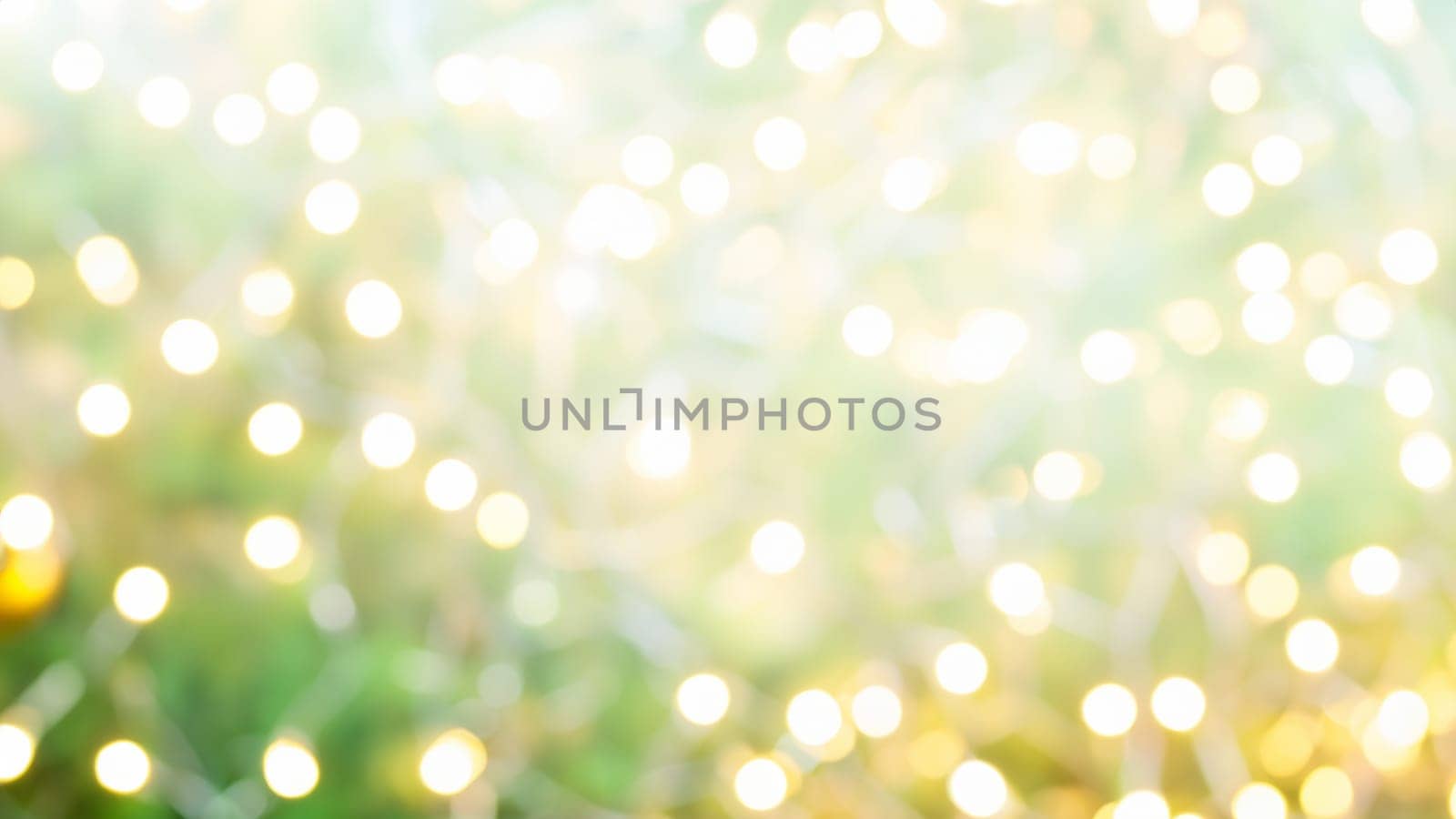 Bright blurred christmas tree with string lights abstract background by DesignMarjolein