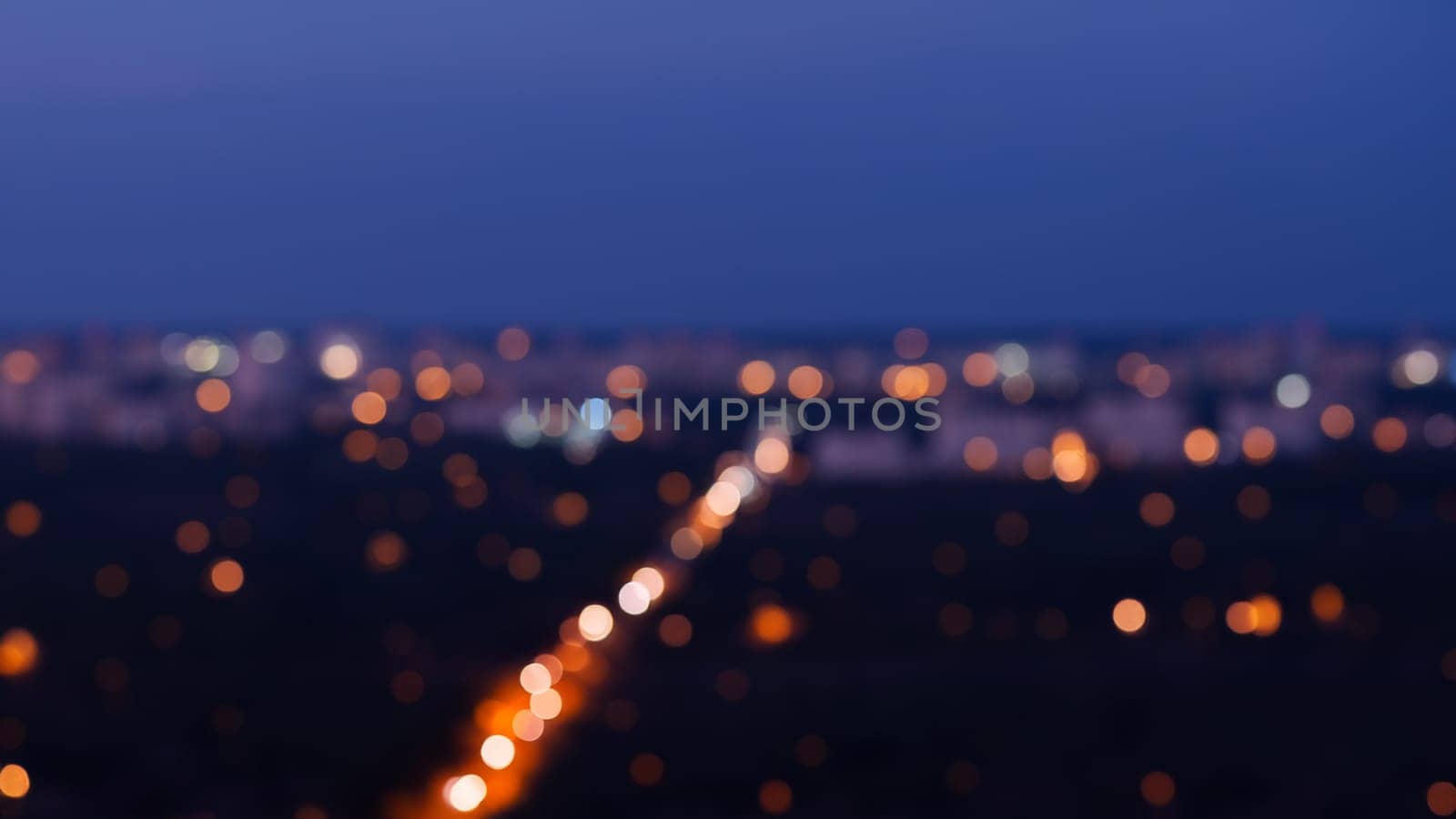 Bokeh of city at night, defocused abstract background.