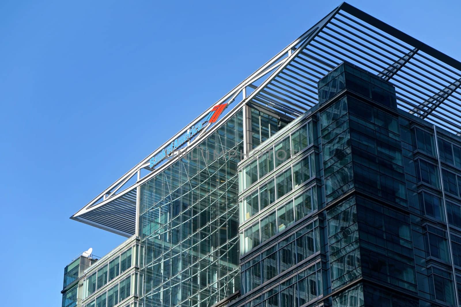 London, United Kingdom - February 03, 2019: Blue and red signage of Bank of America at their London offices in Canary Wharf. BofA is American investment company, one of worlds largest banks by Ivanko