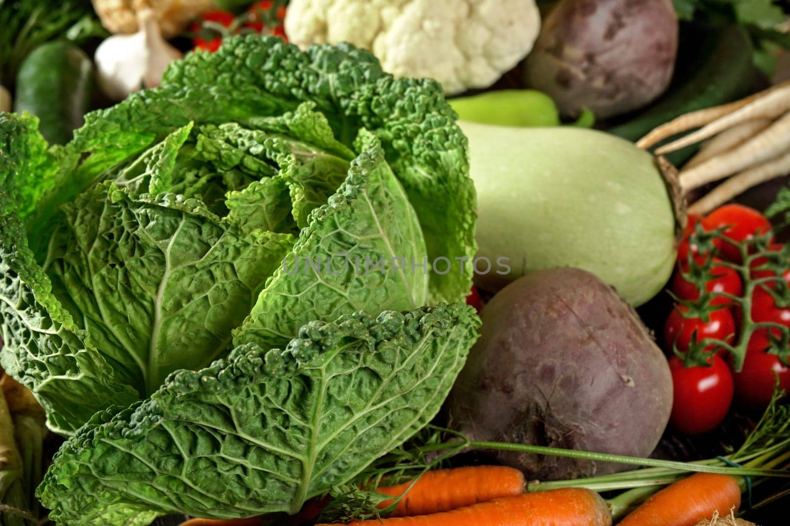 Heap of mixed vegetables - savoy cabbage, beet root, zucchini, tomatoes, cauliflower carrot and other veggies