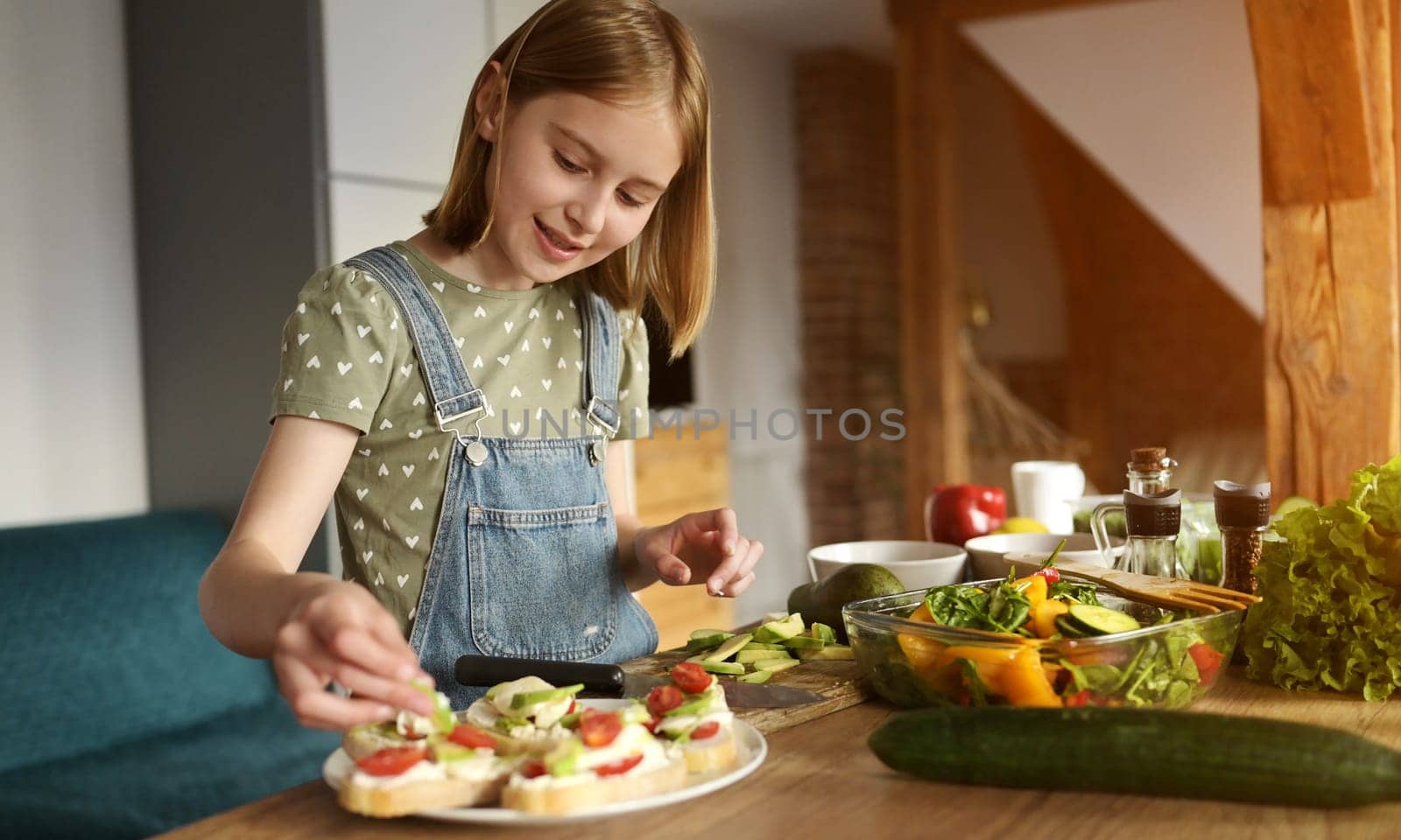 Girl with vegetables at kitchen by GekaSkr