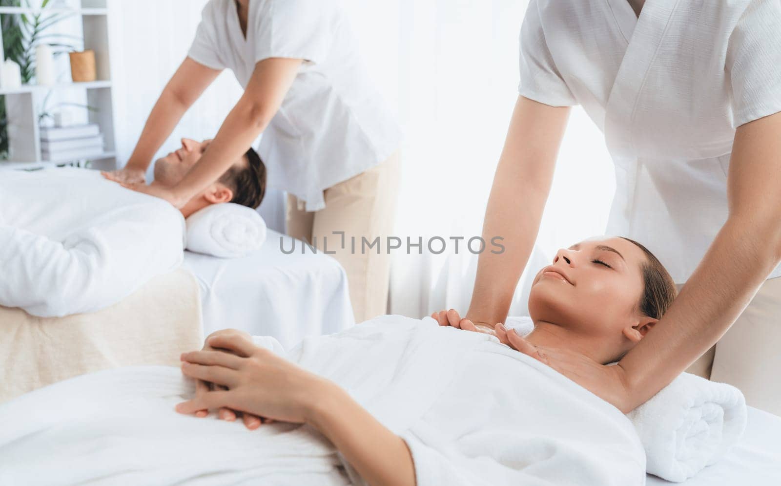 Caucasian couple customer enjoying relaxing anti-stress massage. Quiescent by biancoblue