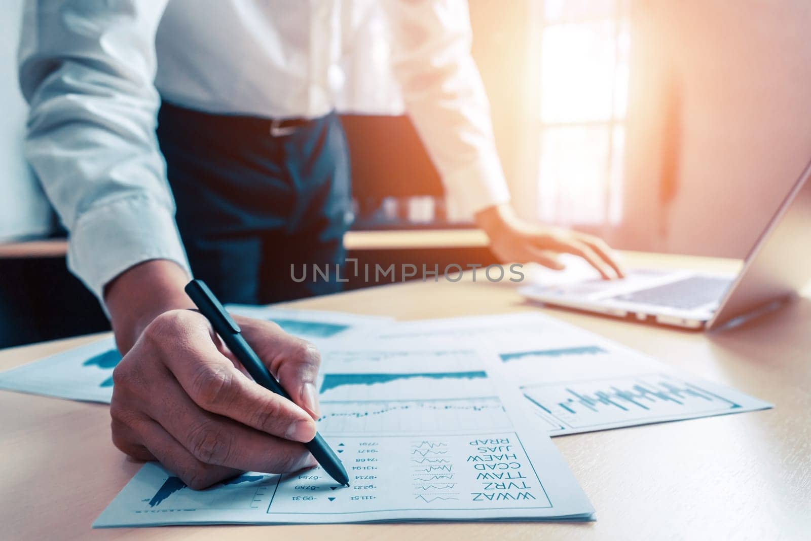 Businessman accountant or financial expert analyze business report graph and finance chart at corporate office. Concept of finance economy, banking business and stock market research. uds