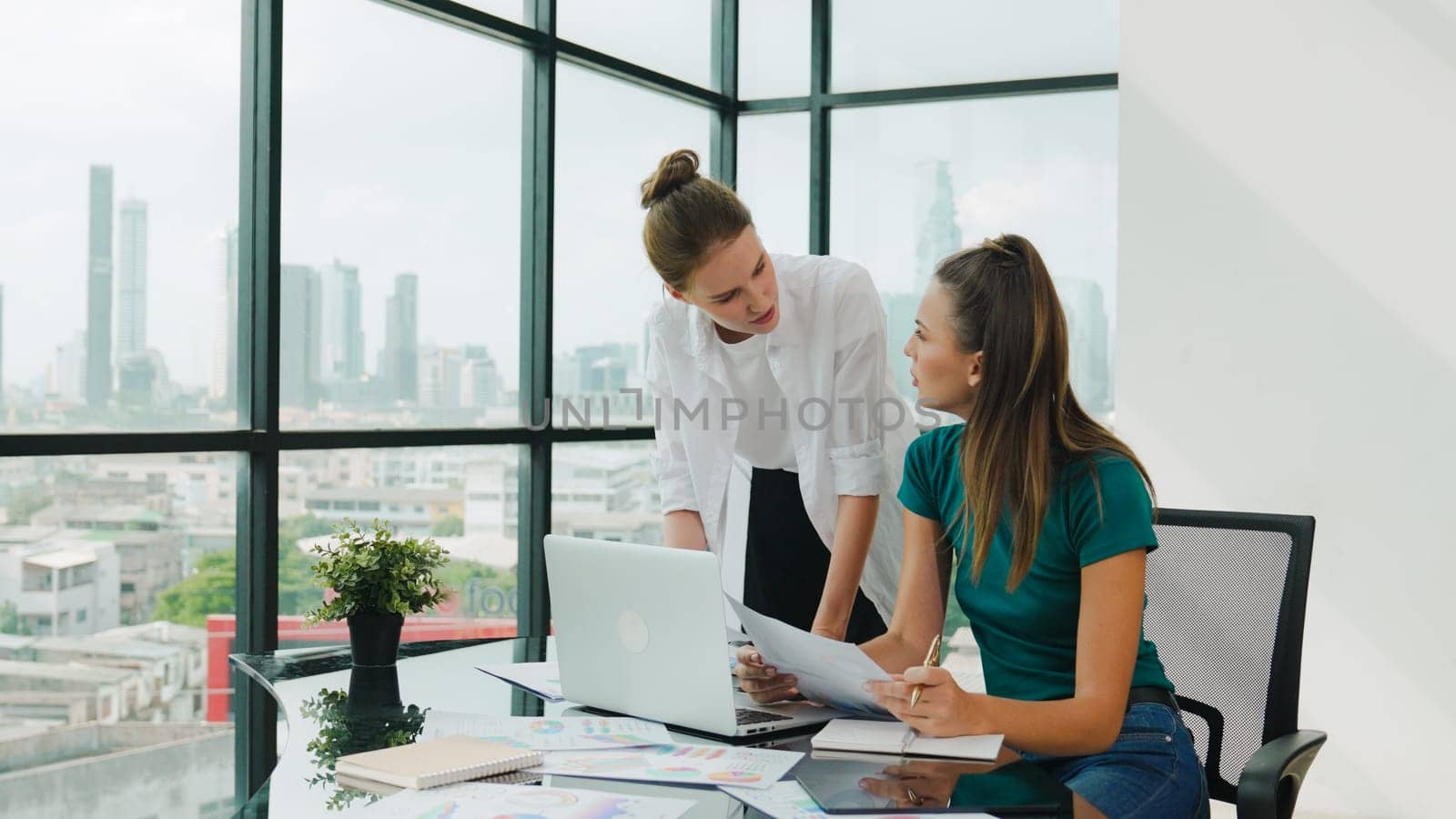 Skilled businesswoman look stress while discuss about financial strategy. Smart business team brainstorming, talking consulting sales plan, idea by using statistic document with tension. Tracery