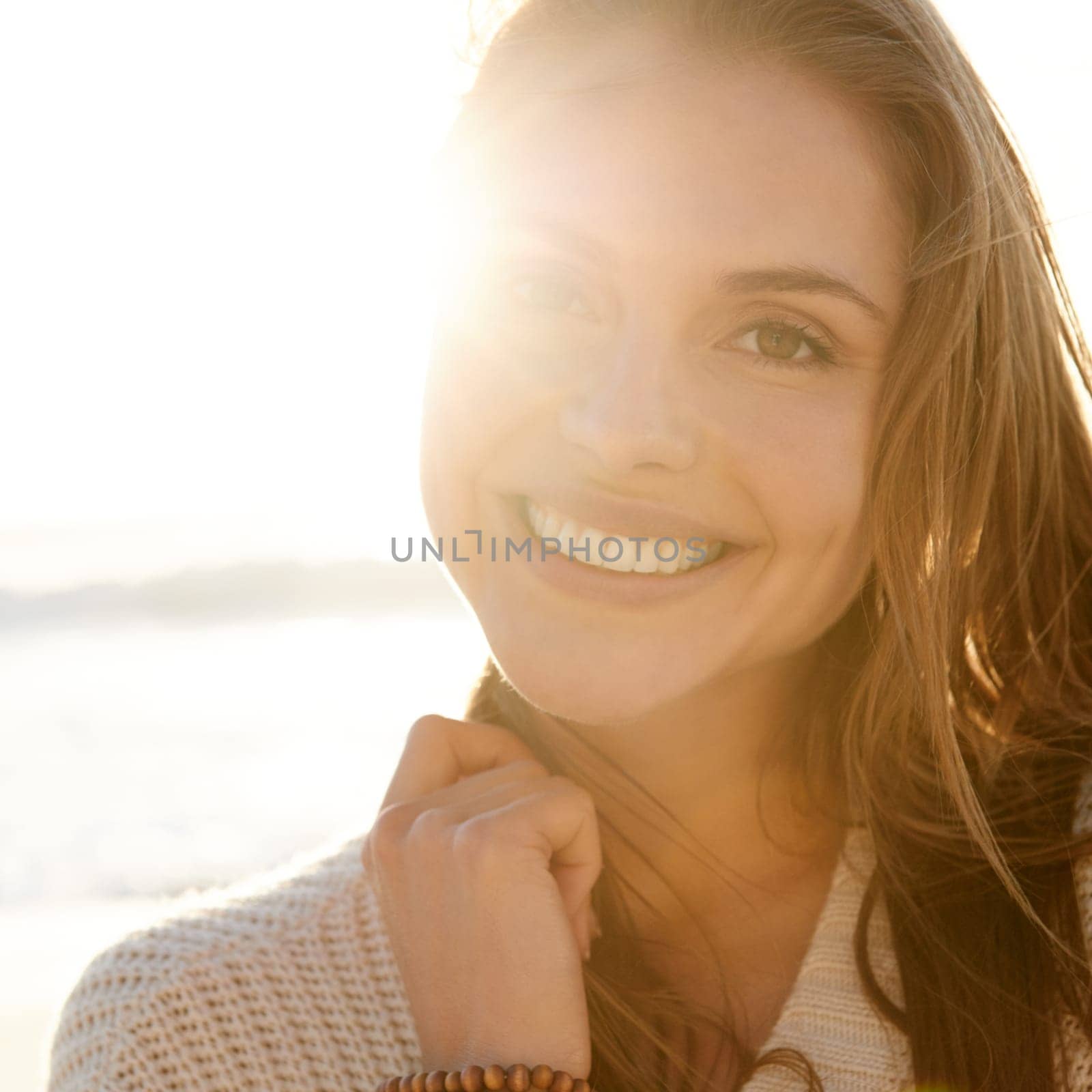 Portrait, summer and woman on beach at sunset for travel, tropical vacation or island holiday closeup. Face, smile and nature with happy young tourist outdoor on coast by sea or ocean in paradise by YuriArcurs