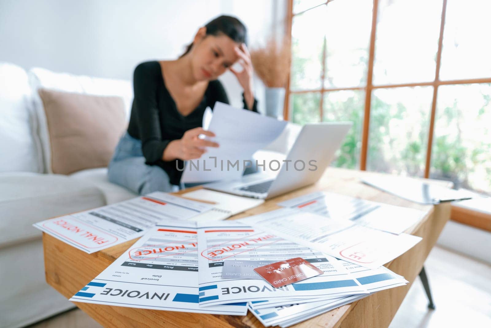 Stressed young woman has financial problems credit card debt to pay uttermost by biancoblue