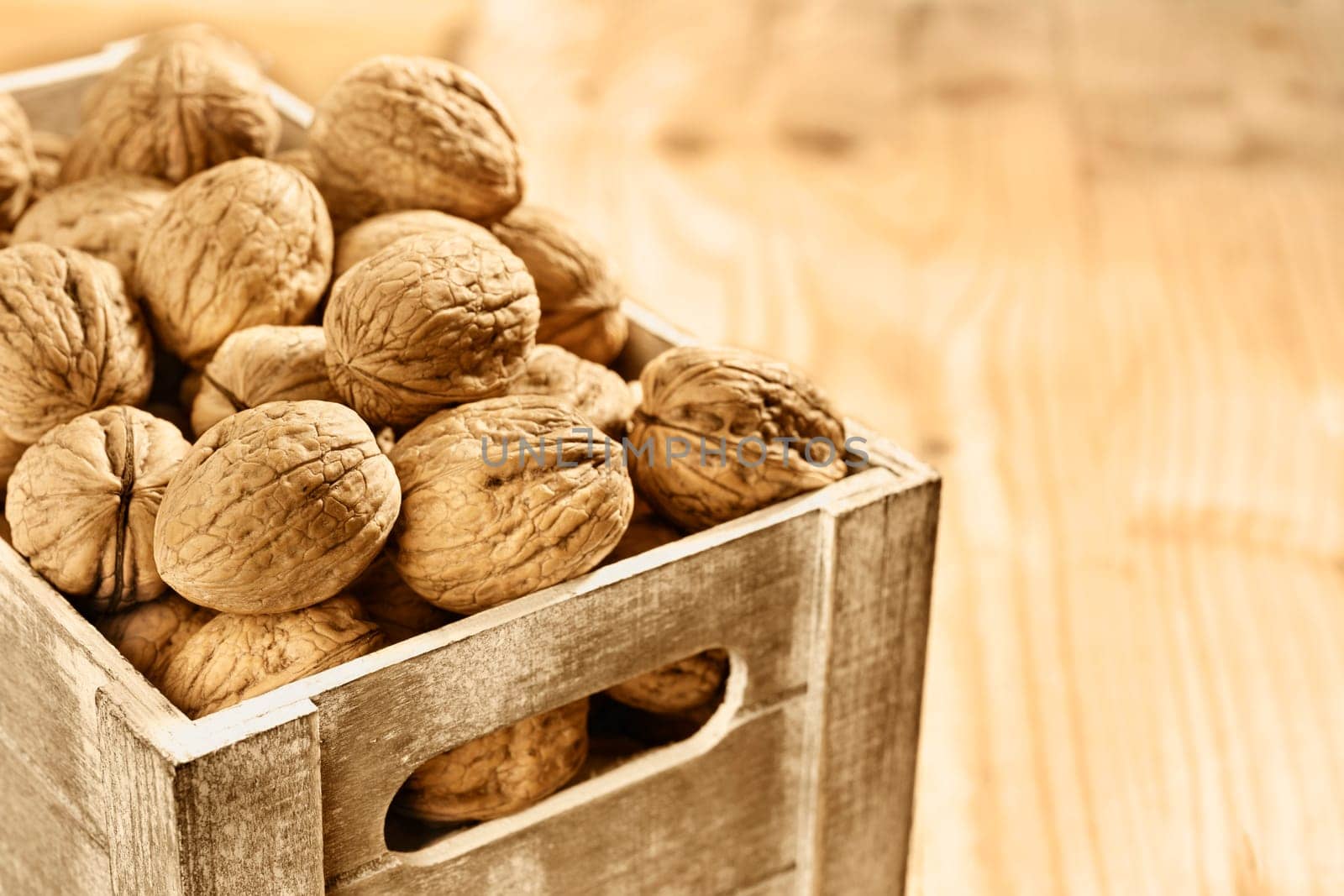 Fruit of walnuts in wooden box , healthy eating ,nutritional supplement