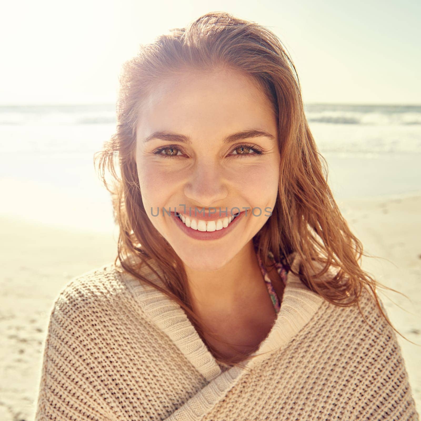 Portrait, travel and happy woman at a beach for summer, break or vacation, adventure or holiday. Ocean, face and female person smile at the sea with freedom, good mood or solo trip in South Africa.