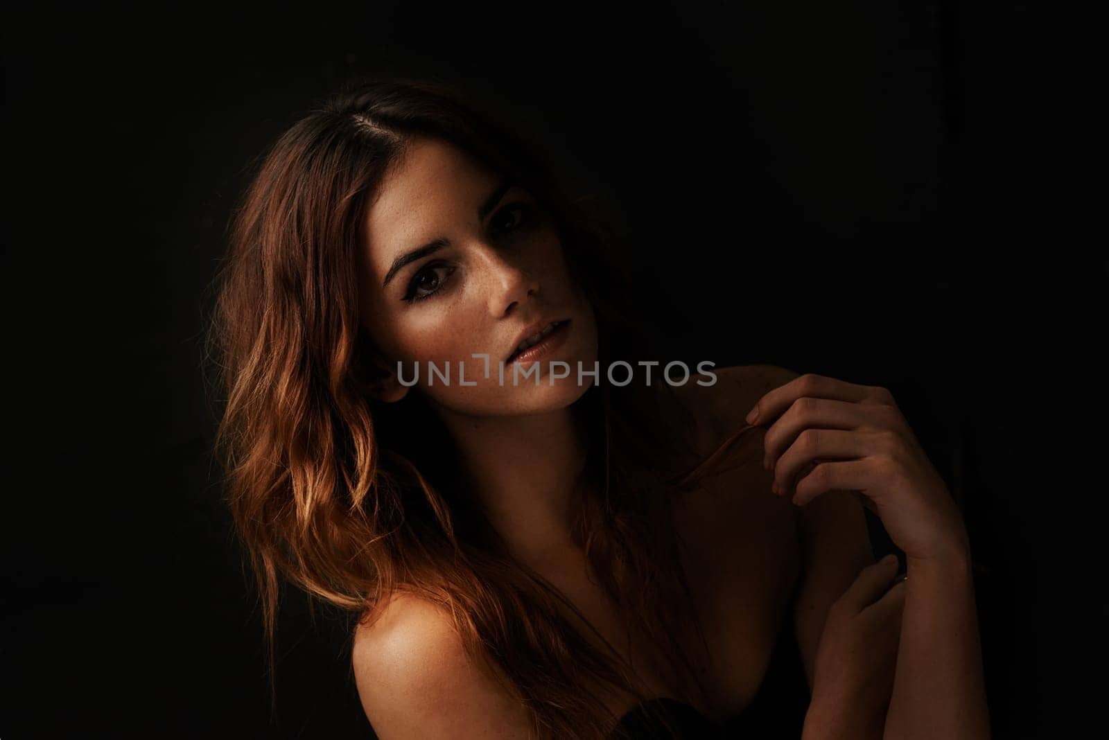 Woman, hair care and ginger with portrait, shadow and shampoo treatment in a studio. Relax, beauty and female person with wavy texture and fresh haircut with balayage coloring with black background.