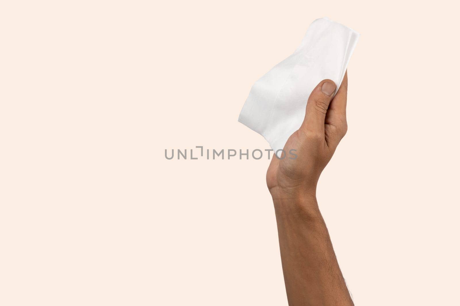 Black male hand holding a cleaning cloth isolated. Cleaning concept. by TropicalNinjaStudio