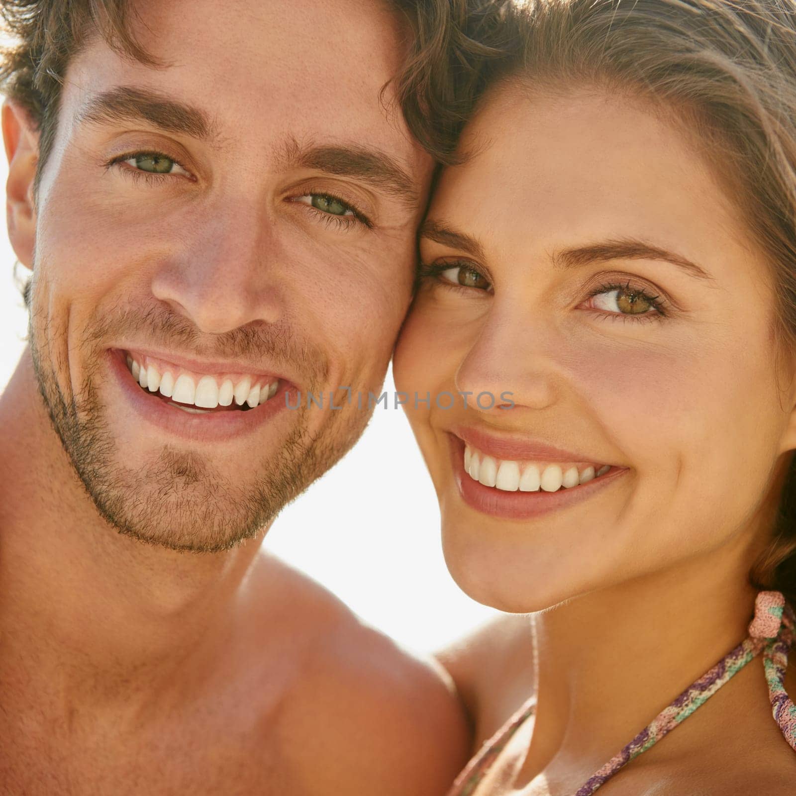Love, portrait and happy couple hug at a beach for travel, vacation and bonding in nature together. Ocean, adventure and face of people at the sea with care, trust and support, smile and fun outdoor.