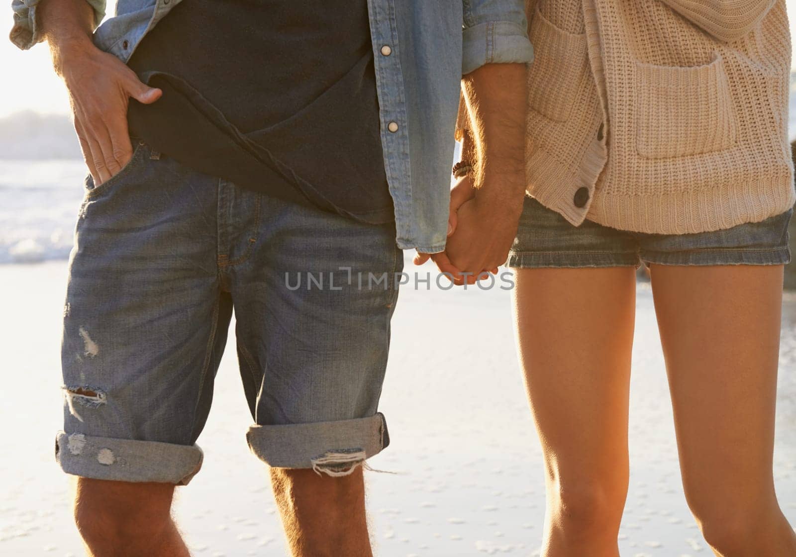 Beach, romance and couple holding hands on relax walk, nature journey or travel vacation in Peru. Love, relationship and closeup of marriage partner, soulmate or people bonding together in nature.