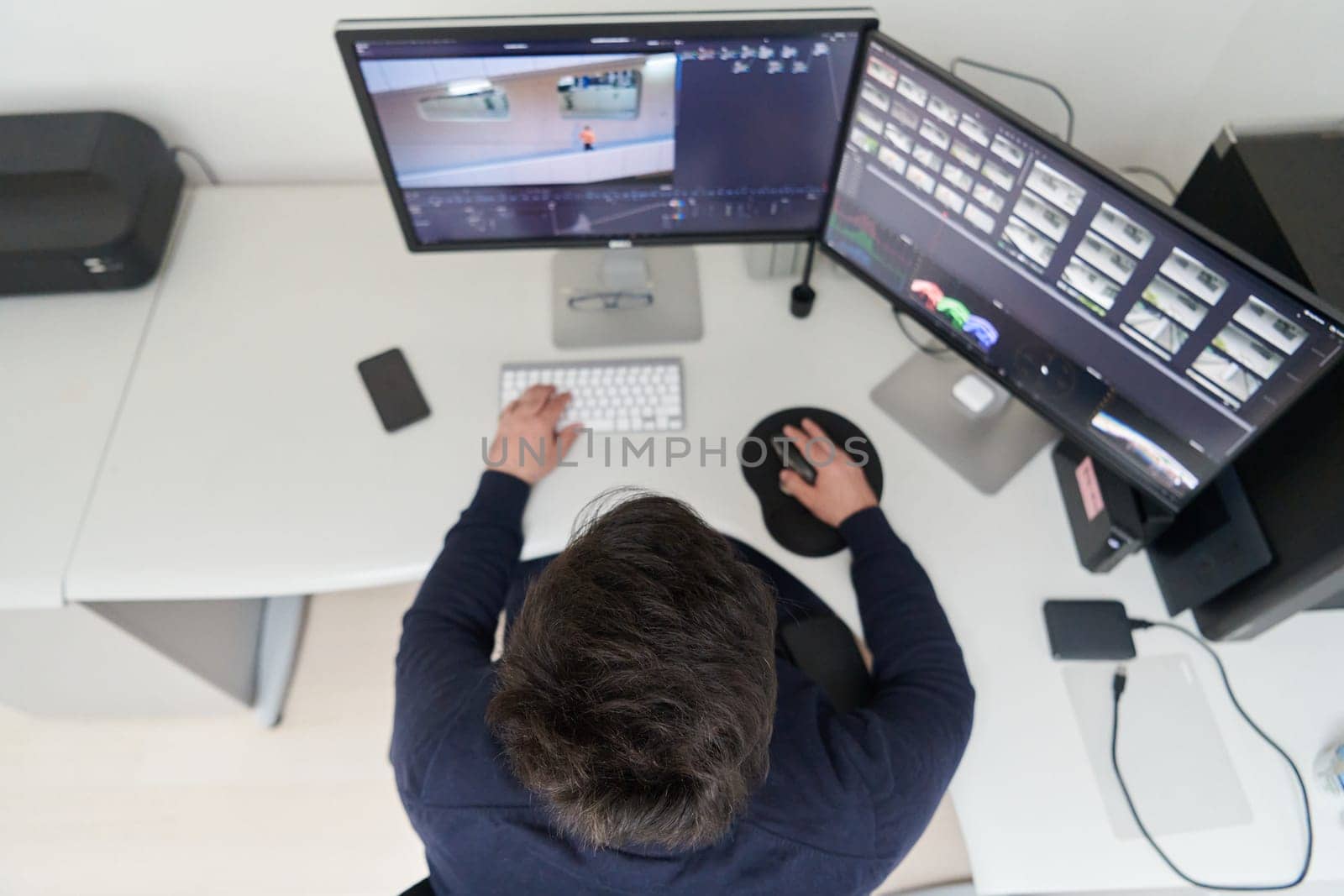 professional video editor enhancing digital footage using specialized software by dotshock