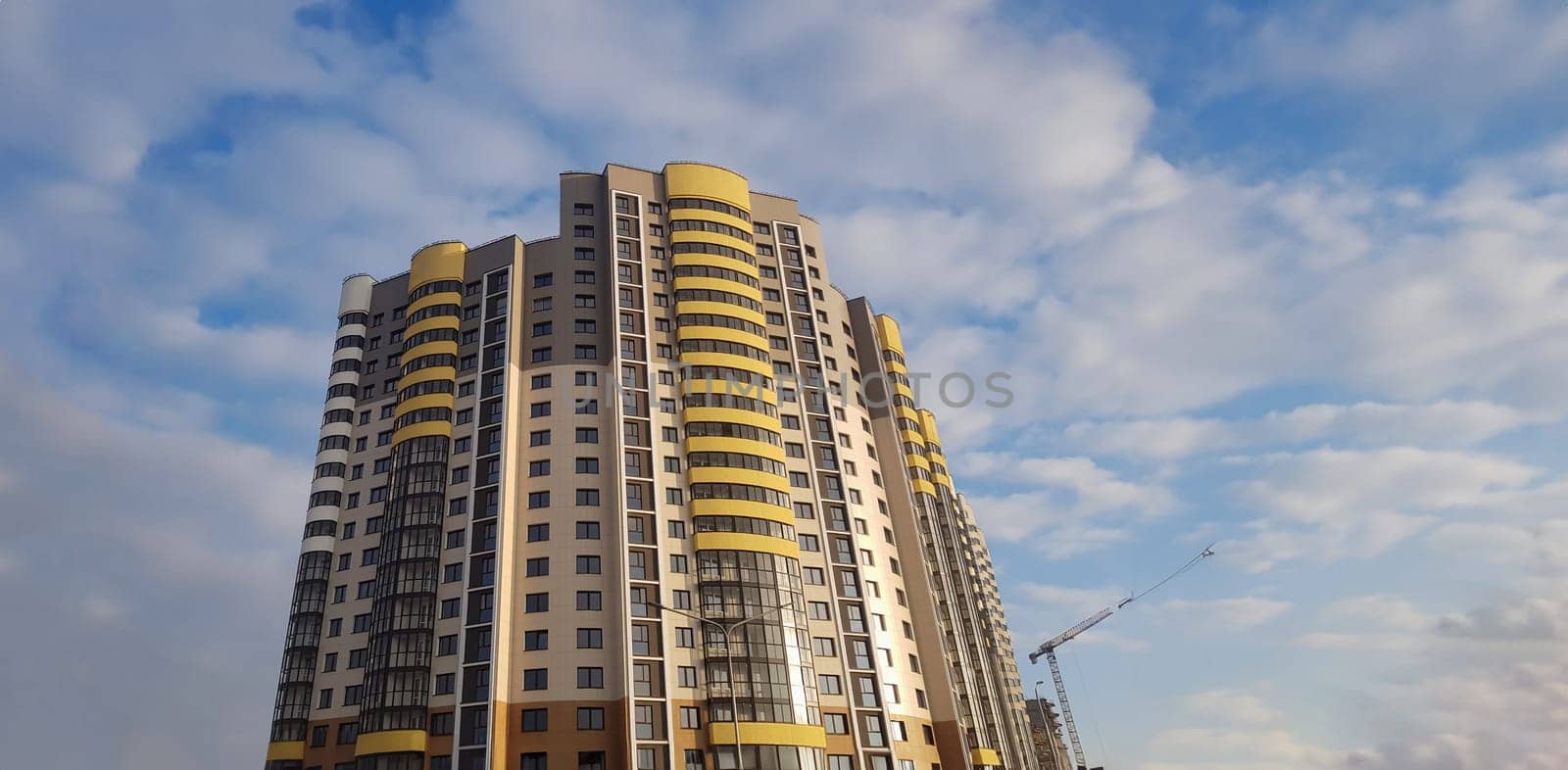 Construction microdistrict city high-rise buildings. Reliability and strength structure. Selling house during an economic crisis. Construction is frozen during pandemic. Job loss at construction site