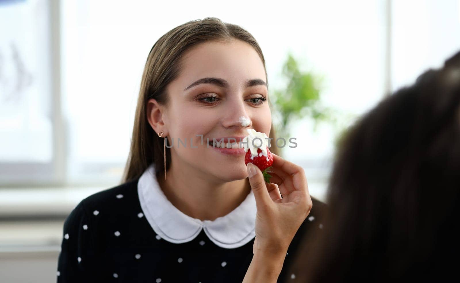 Girl stained her nose with cream from strawberries by kuprevich