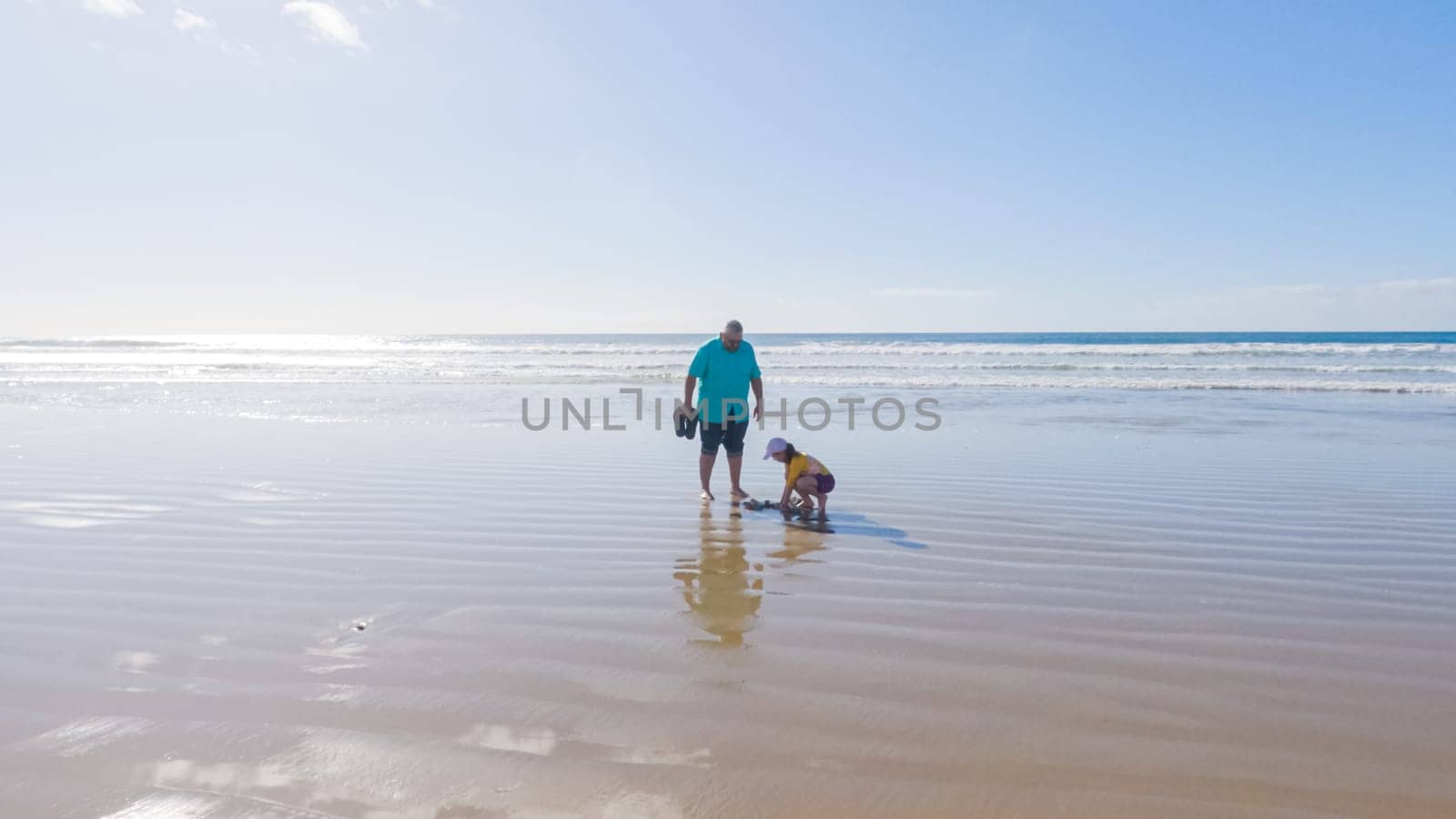 Little girl winter clamming at Pismo Beach by arinahabich