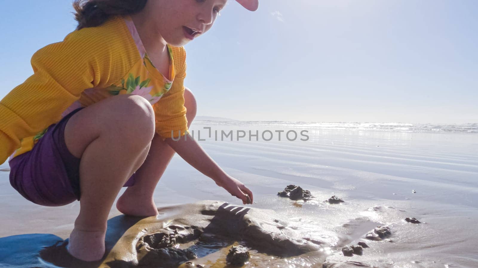 Little girl winter clamming at Pismo Beach by arinahabich