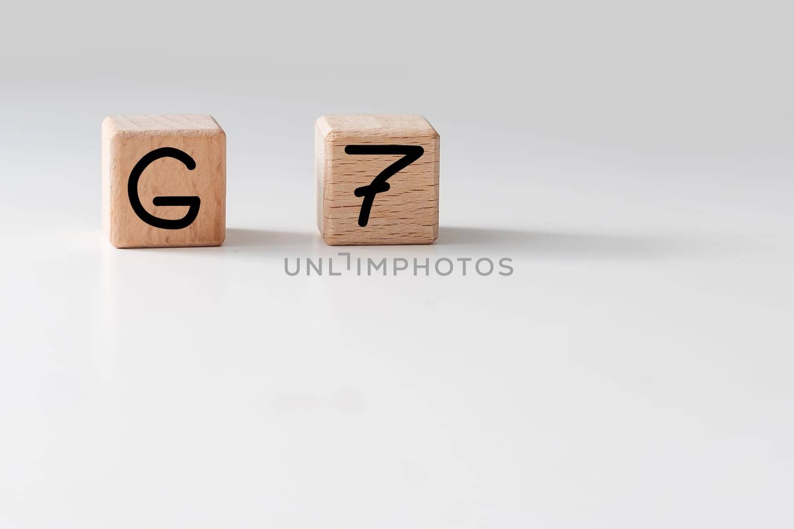 Human hand put wooden block and set technology word G7. Network future. High speed of mobile internet by Andelov13