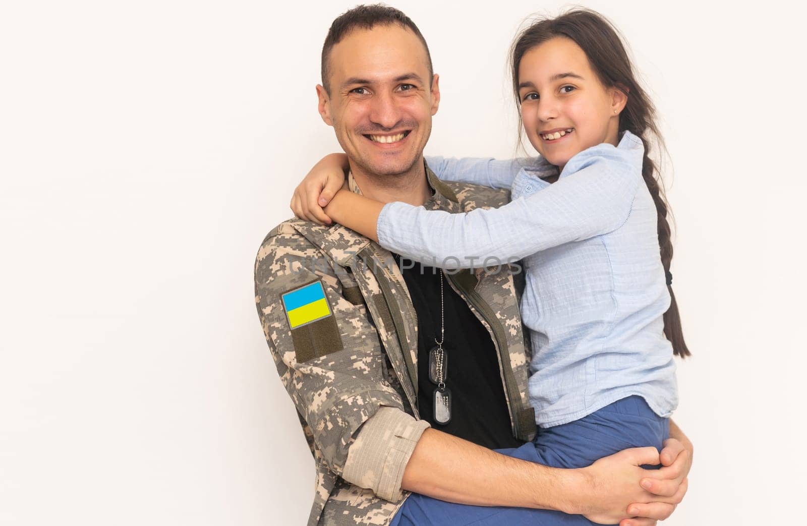 Father in Ukrainian military uniform and his daughter. Family reunion by Andelov13