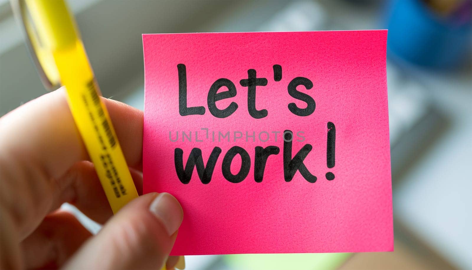 Sticky note in office room or work place with the text Let's work text on a sticky, pen, Desk with business decoration. Brainstorming motivation concept Copy space