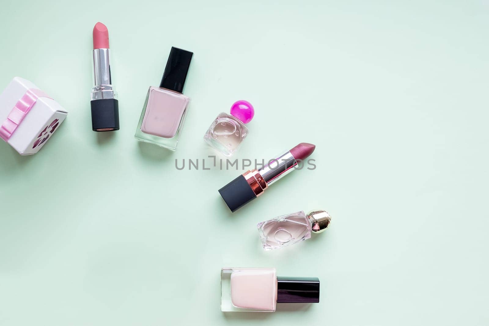 Flat lay for fashion blogger. Woman's glamour makeup beauty products on a white background. nail polishes