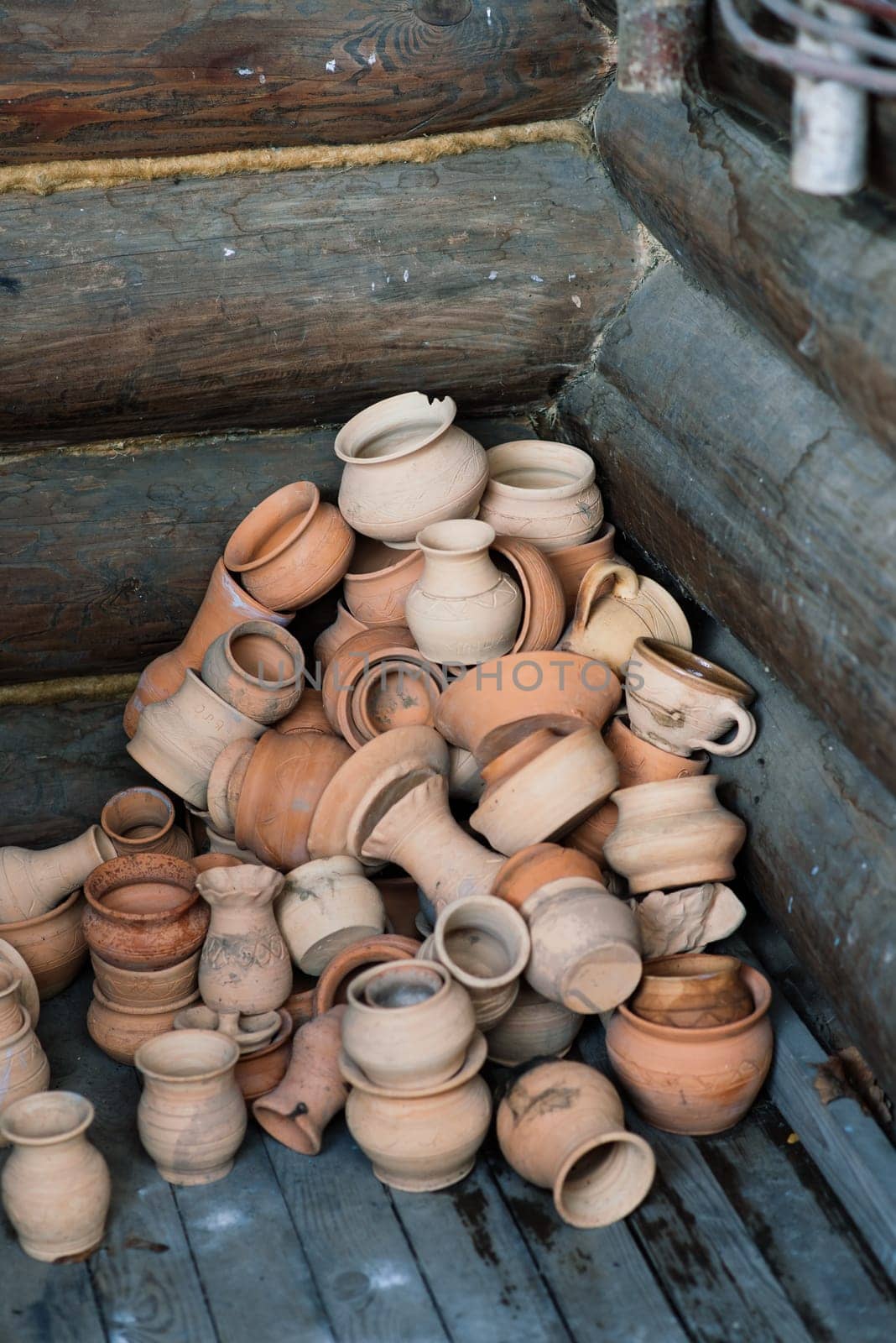 Ceramic clay terracotta jug, pot, vase, kitchen souvenirs in a handmade ceramics street store. by Zelenin
