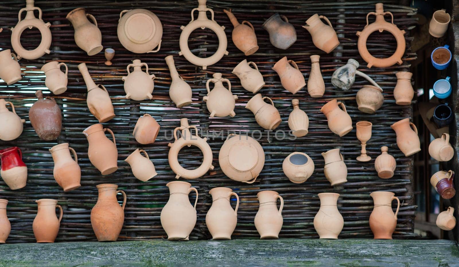 Ceramic clay terracotta jug, pot, vase, kitchen souvenirs in handmade ceramics street store.