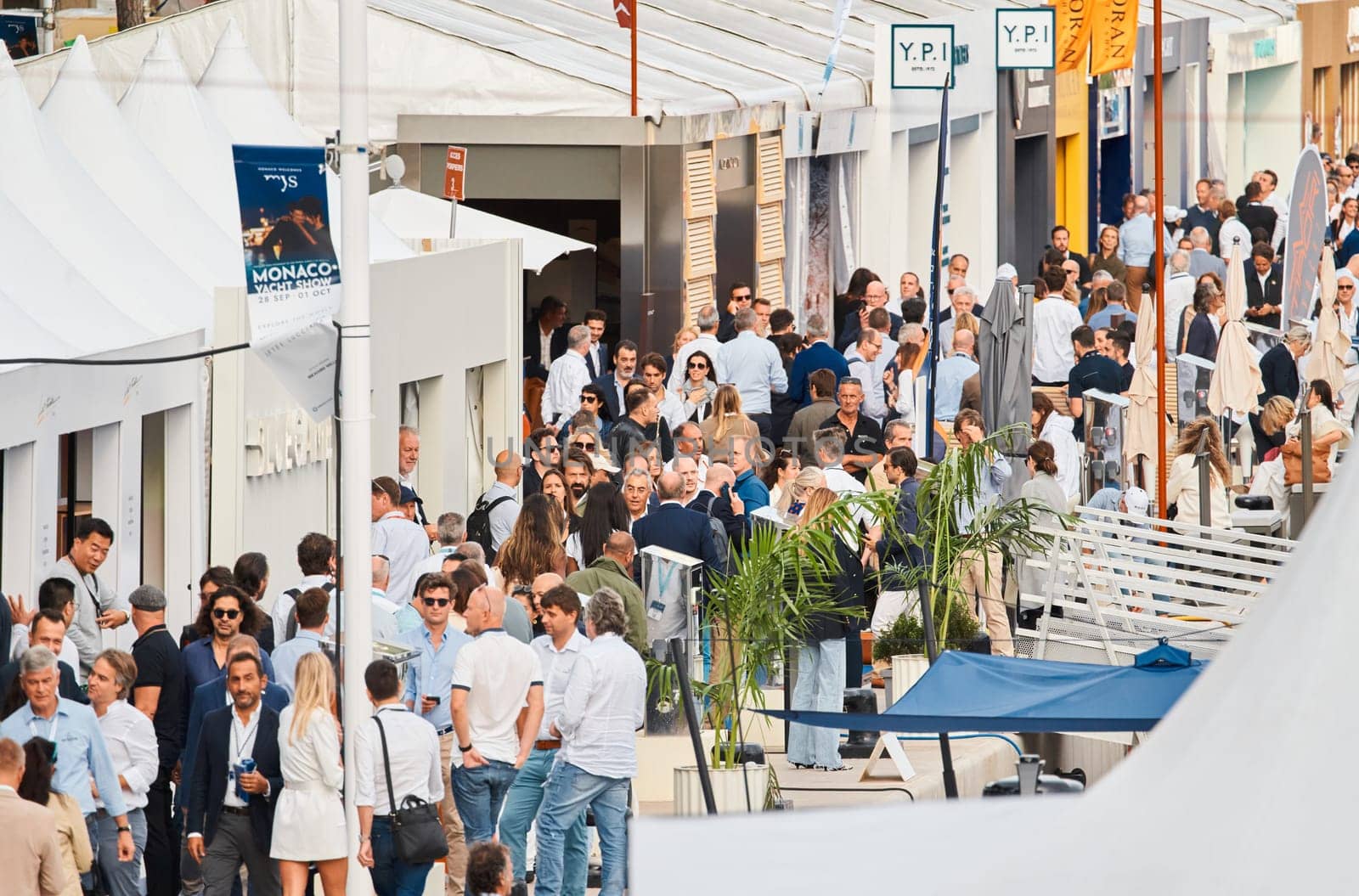 Monaco, Monte Carlo, 29 September 2022 - The famous motorboat exhibition, mega yacht show, clients and yacht brokers discuss the novelties of the boating industry, look at the mega yachts presented. High quality photo