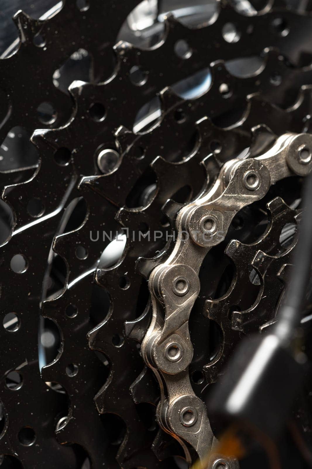 New bicycle chain part close up on black backgroundview photo
