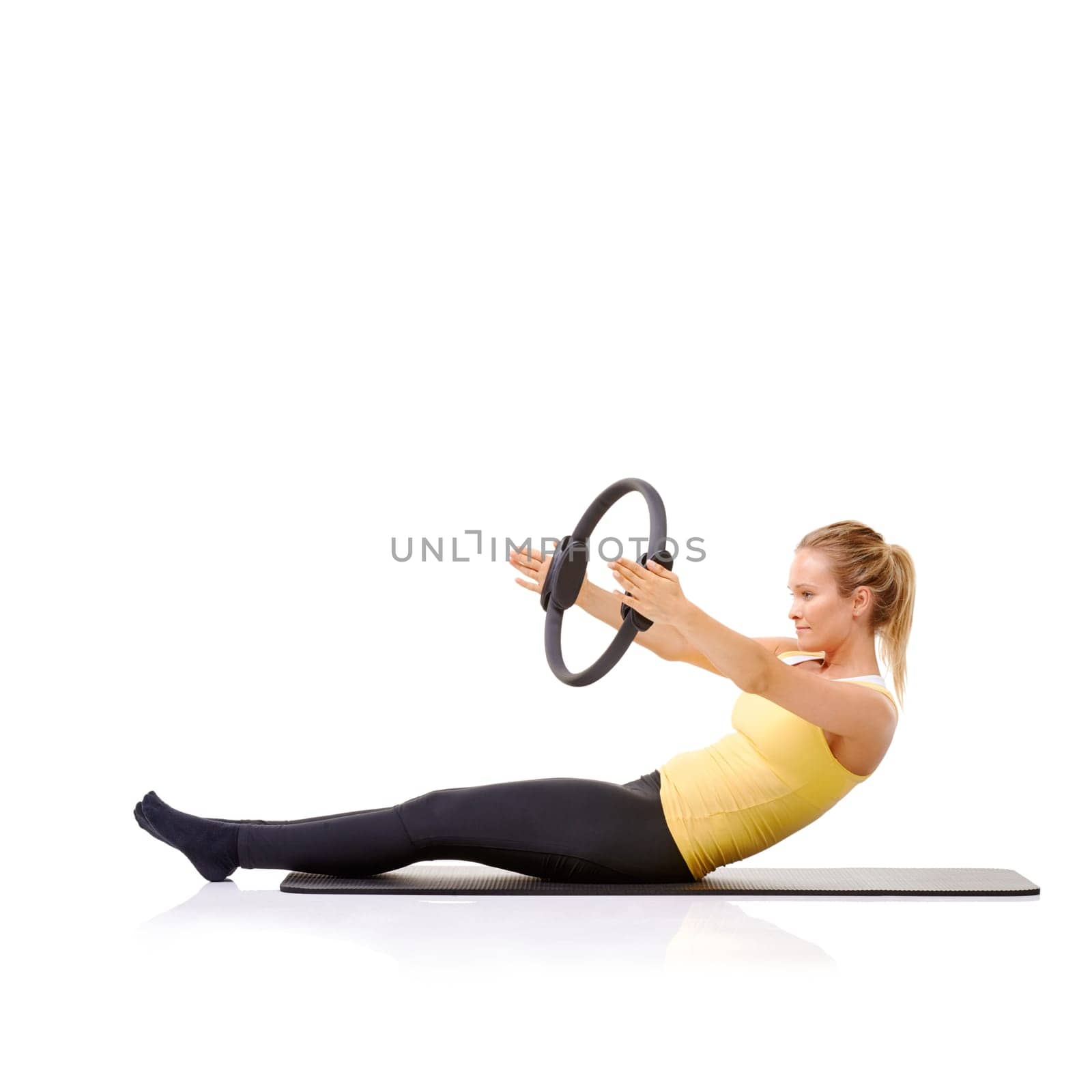 Woman, pilates ring and yoga mat for balance exercise or resistance training, strong core or studio white background. Female person, equipment for muscle wellbeing or abs workout, health or mockup.