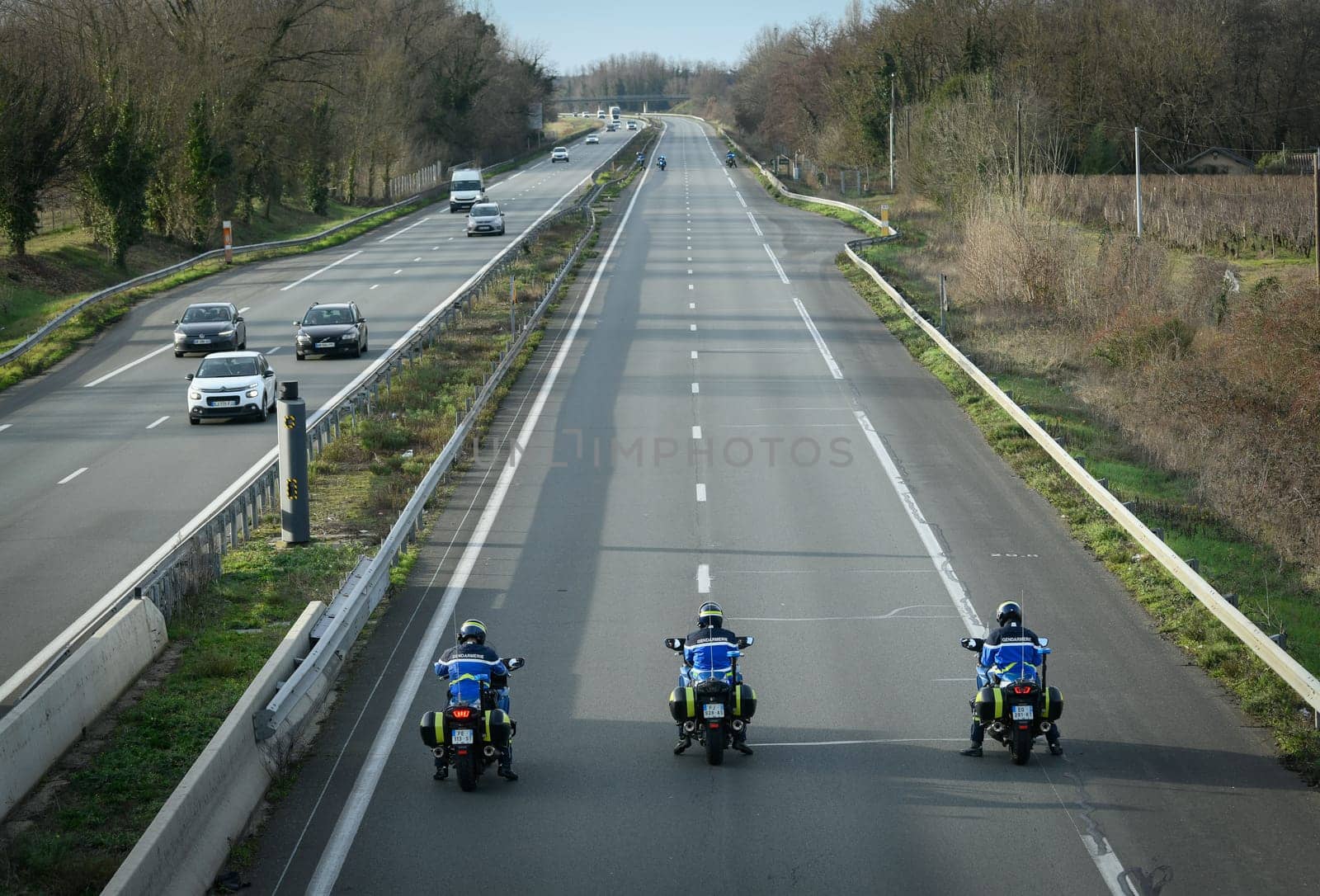 France, Bordeaux, 29 January 2024, Farmers' demonstration, mobile gendarmes on their motorbikes securing a demonstration by French farmers on a motorway in south-west France. High quality 4k footage