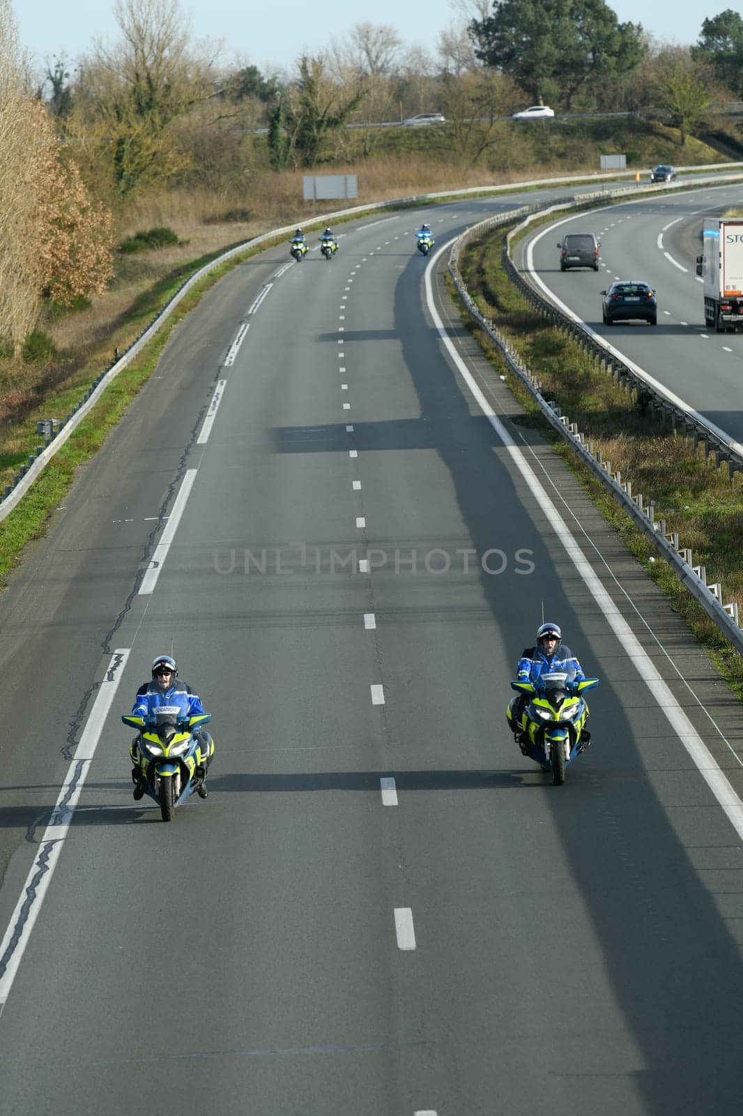 France, Bordeaux, 29 January 2024, Farmers' demonstration, mobile gendarmes on their motorbikes securing a demonstration by French farmers on a motorway in south-west France. High quality 4k footage