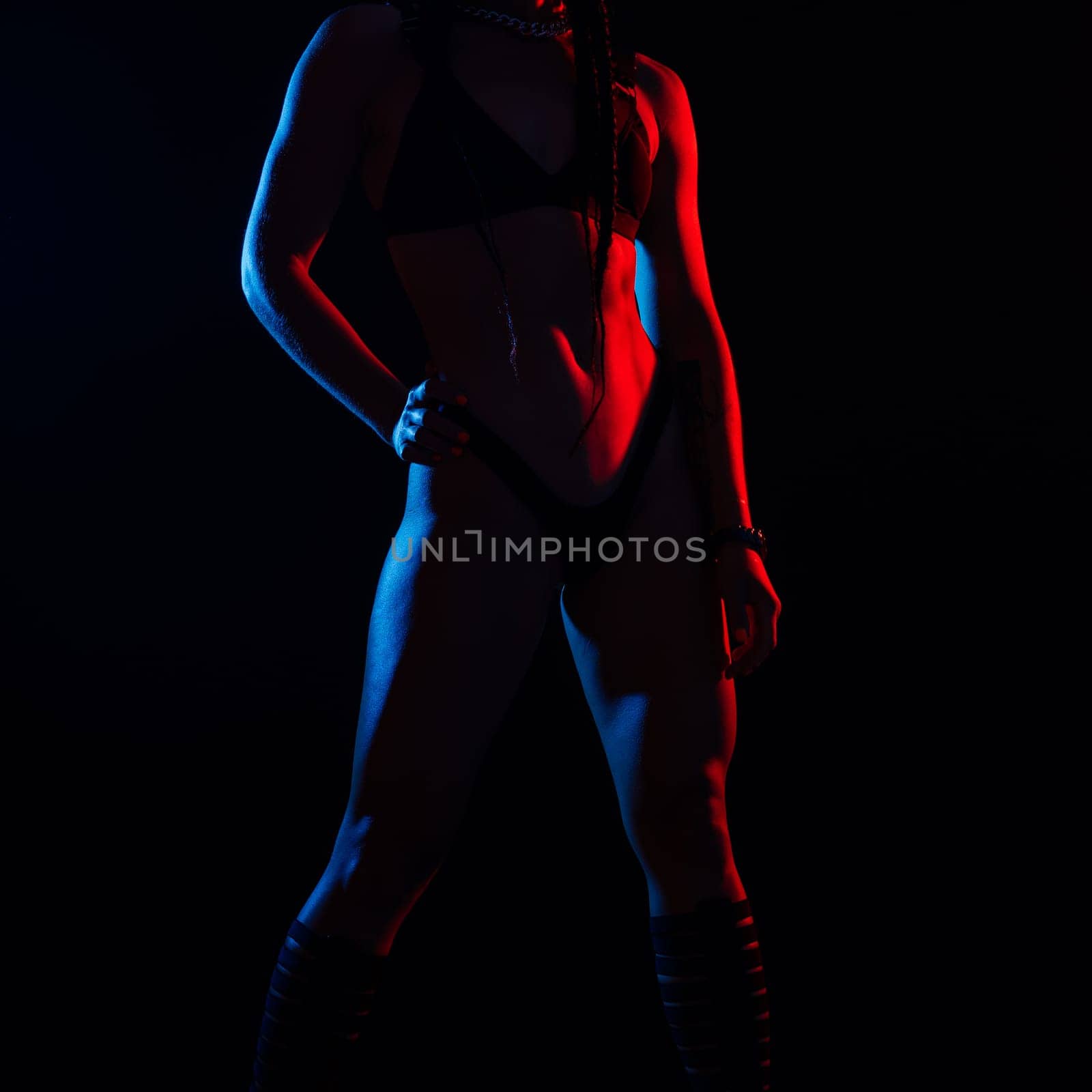 Young woman in underwear is in the studio with neon lights. by Zelenin