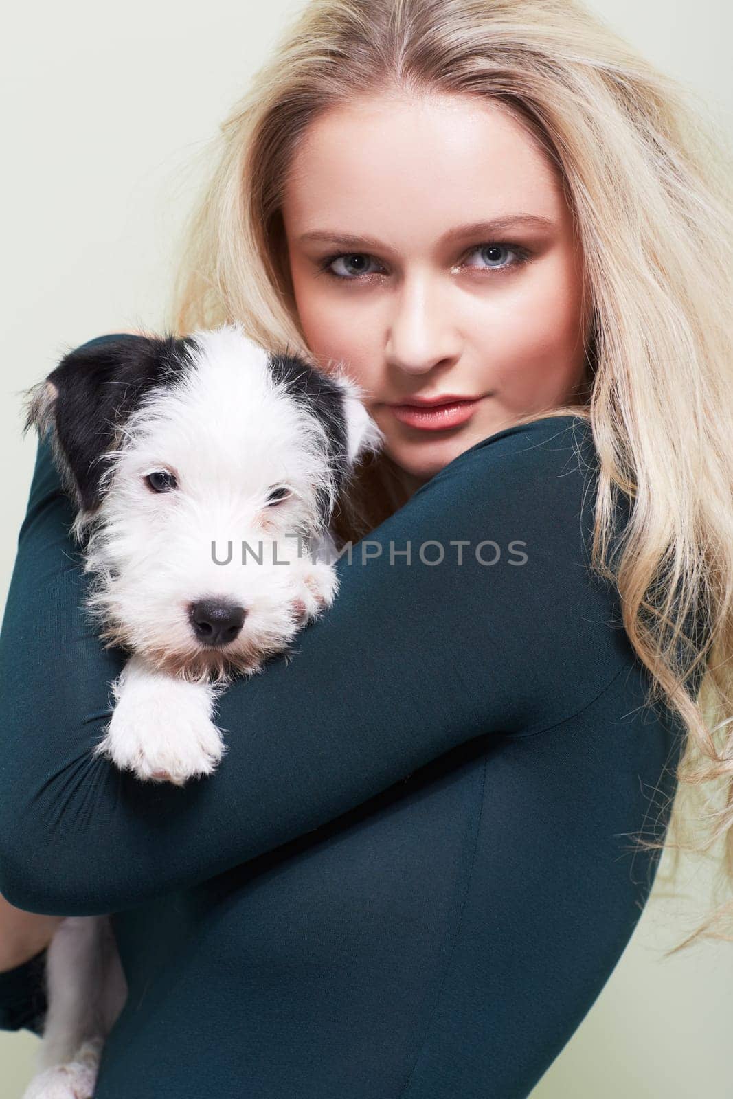 Portrait, hug and woman with a dog in her home with love, care and bonding, trust and chilling together. Puppy, love and face of female person embracing Jackapoo pet in house with support or security.