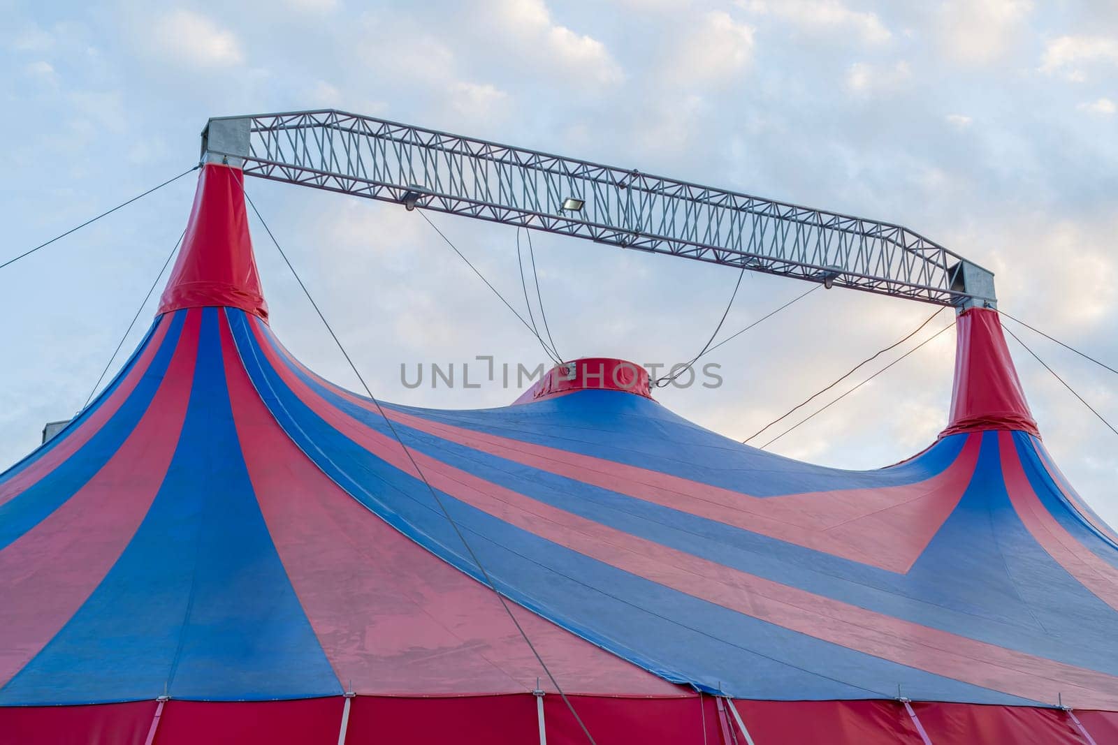 The dome of the circus against the blue sky. photo