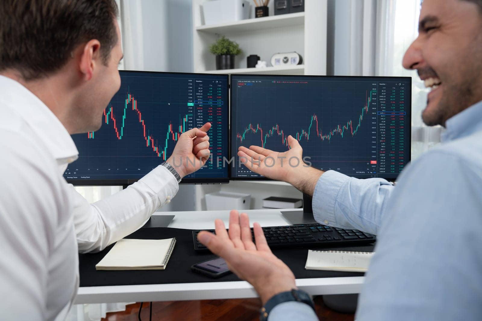 Successful stock exchange traders focusing on high profit chart investment on dynamic database, analyzing on monitor. Concept of discussing financial technology growth at workplace. Sellable.