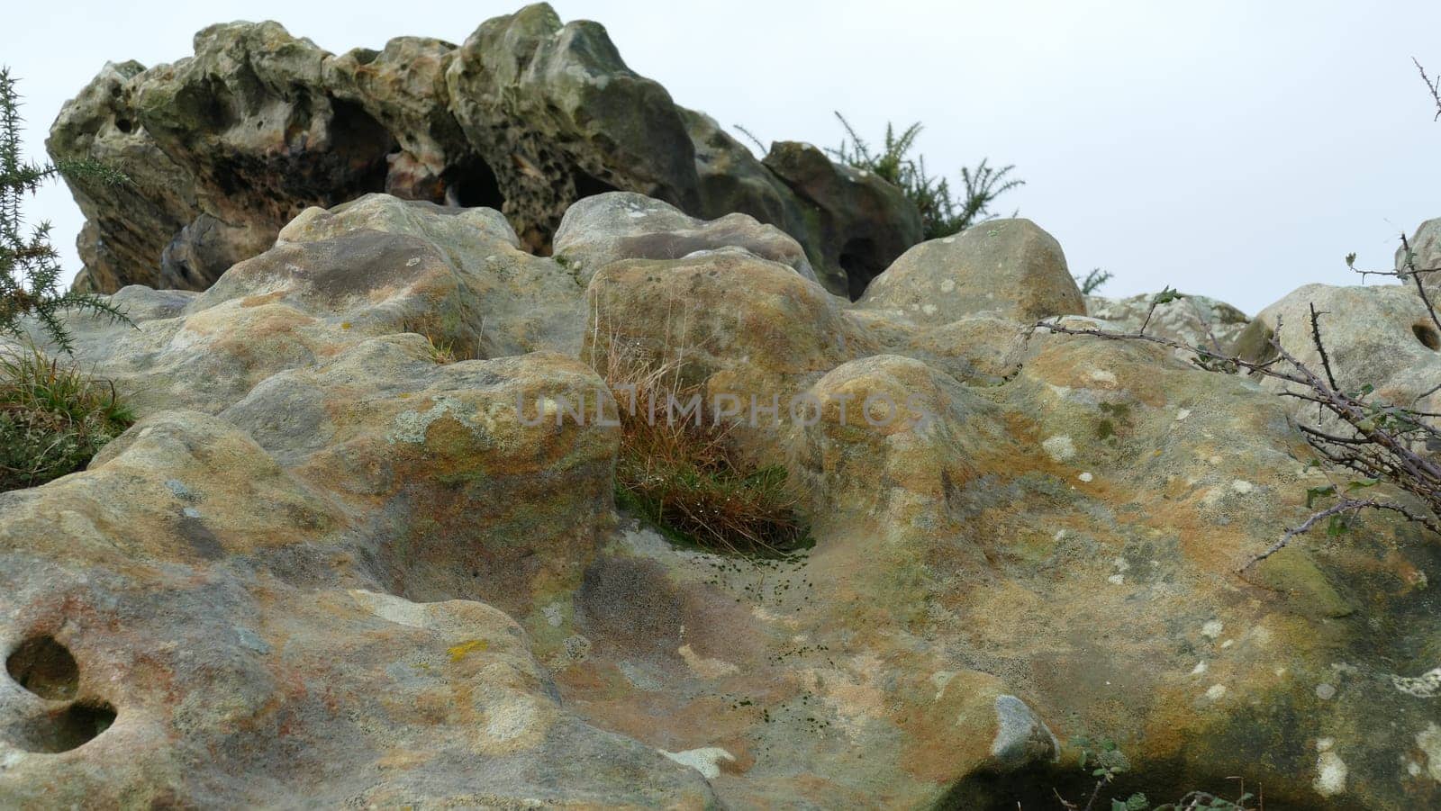 Sandstone with vegetation on a mountain top by XabiDonostia