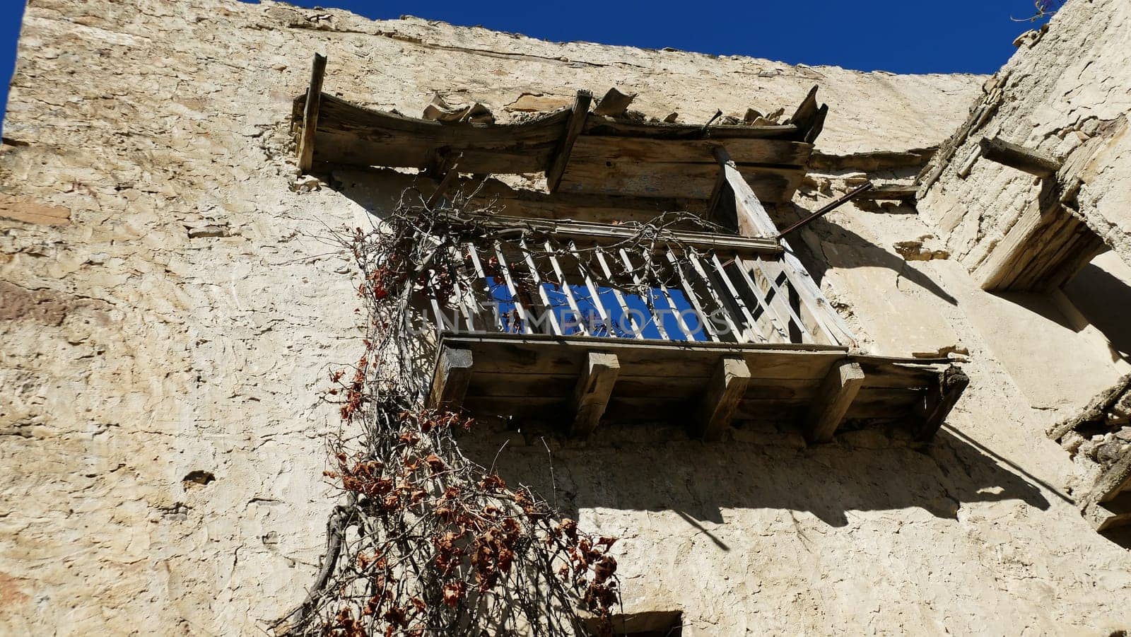 Balcony in an uninhabited village in the ruins of Yesa in Navarre by XabiDonostia