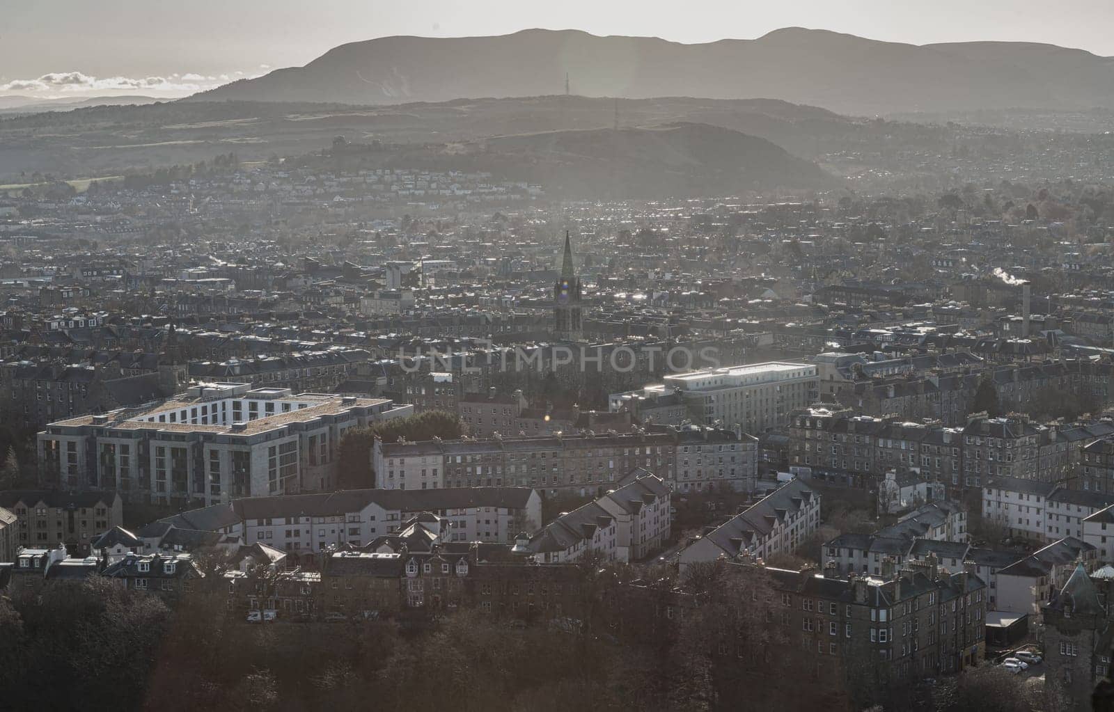 Edinburgh, Scotland - Jan 17, 2024 - Amazing Edinburgh Cityscape and Edinburgh Castle seen from the top of Salisbury Crags. Destinations in Europe, Copy space, Selective focus.