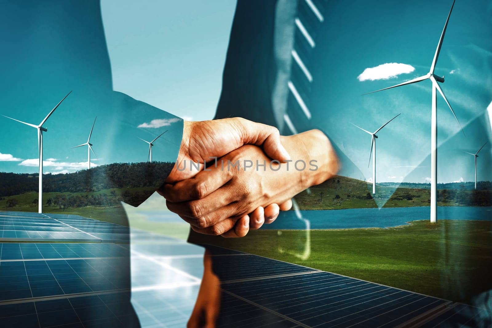 Double exposure graphic of business people handshake over wind turbine farm and green renewable energy worker interface. Concept of sustainability development by alternative energy. uds