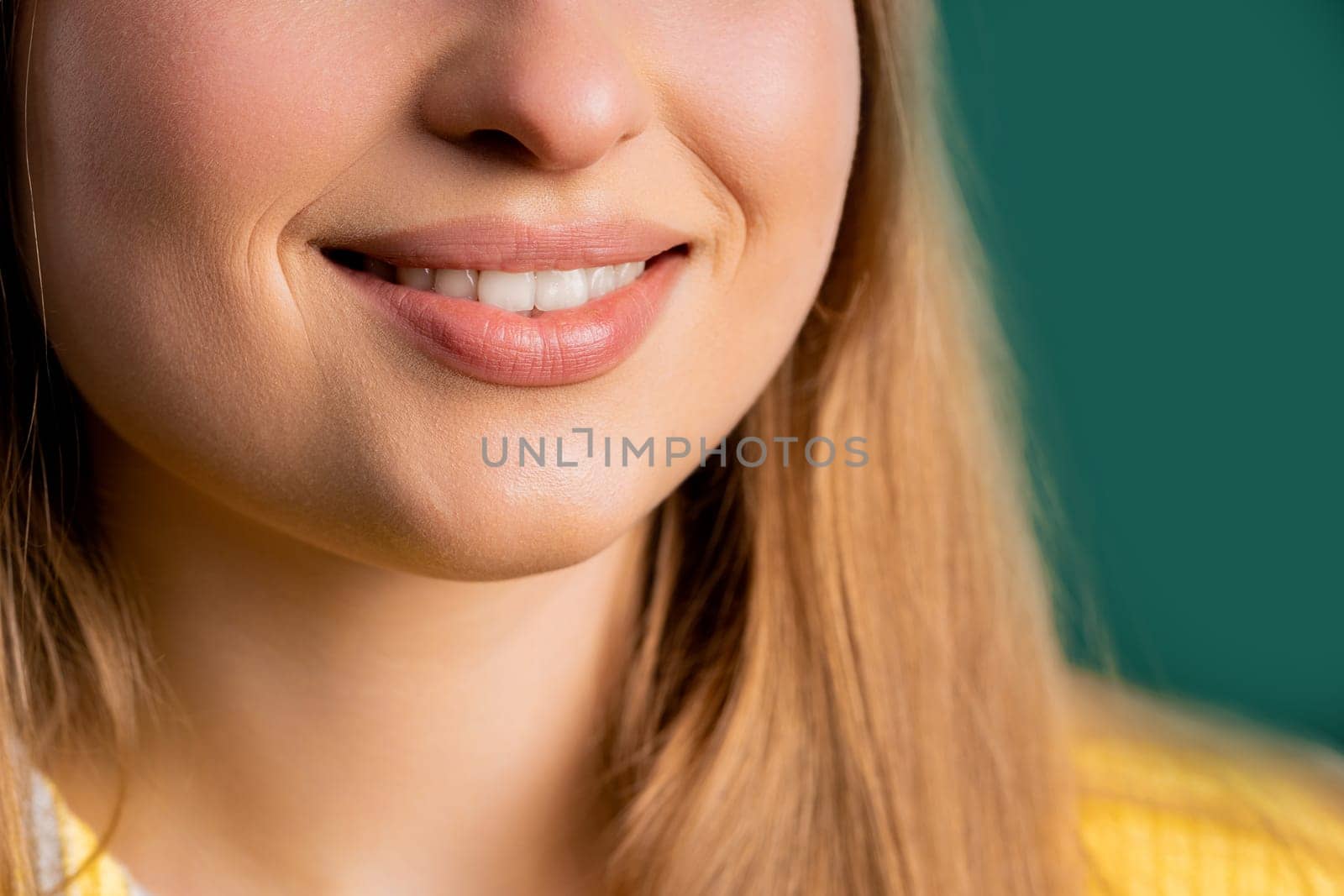 Mouth of charming smiling blonde woman. Perfect healthy teeth, lips, kind smile by kristina_kokhanova